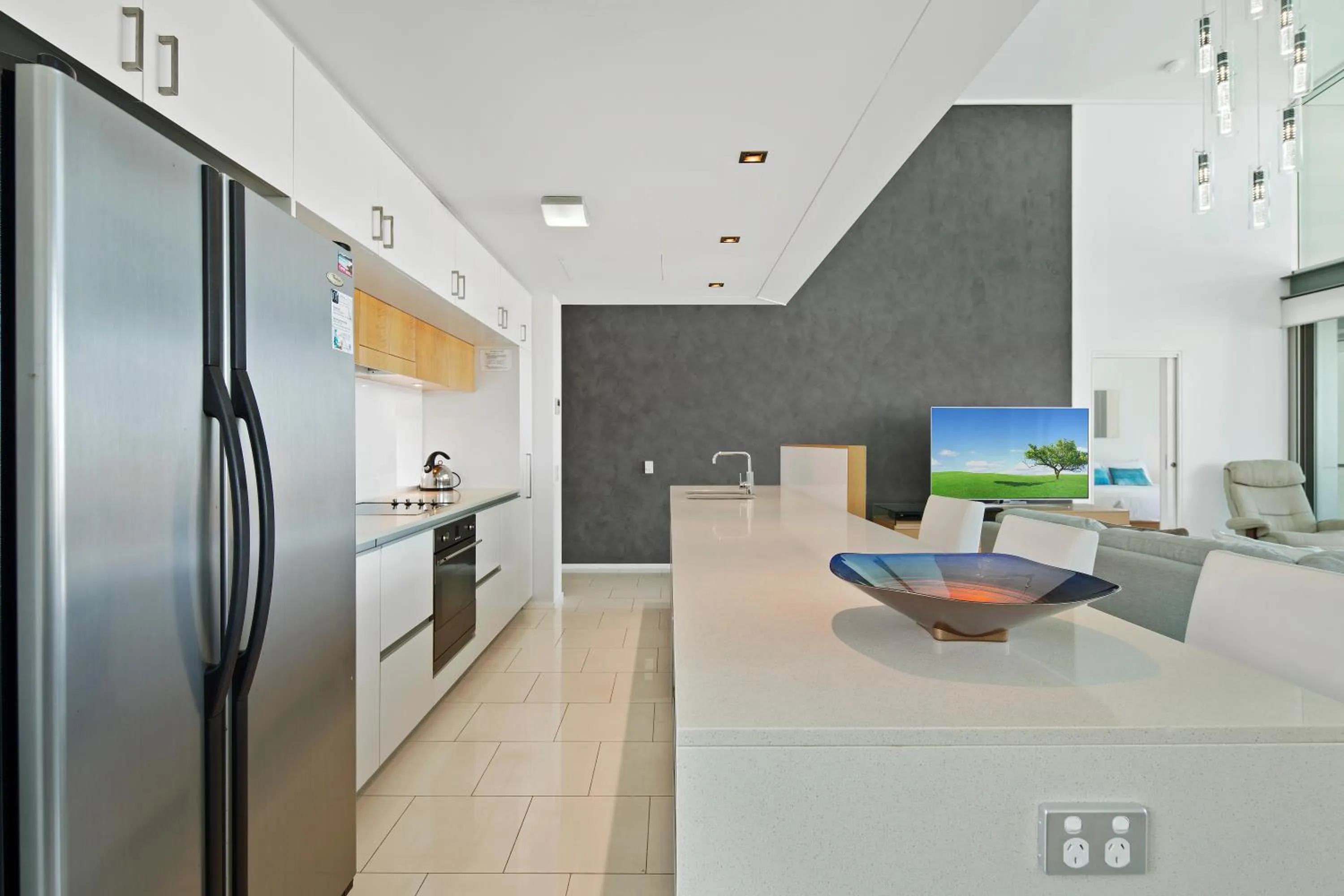 Kitchen or kitchenette in Peninsula Airlie Beach