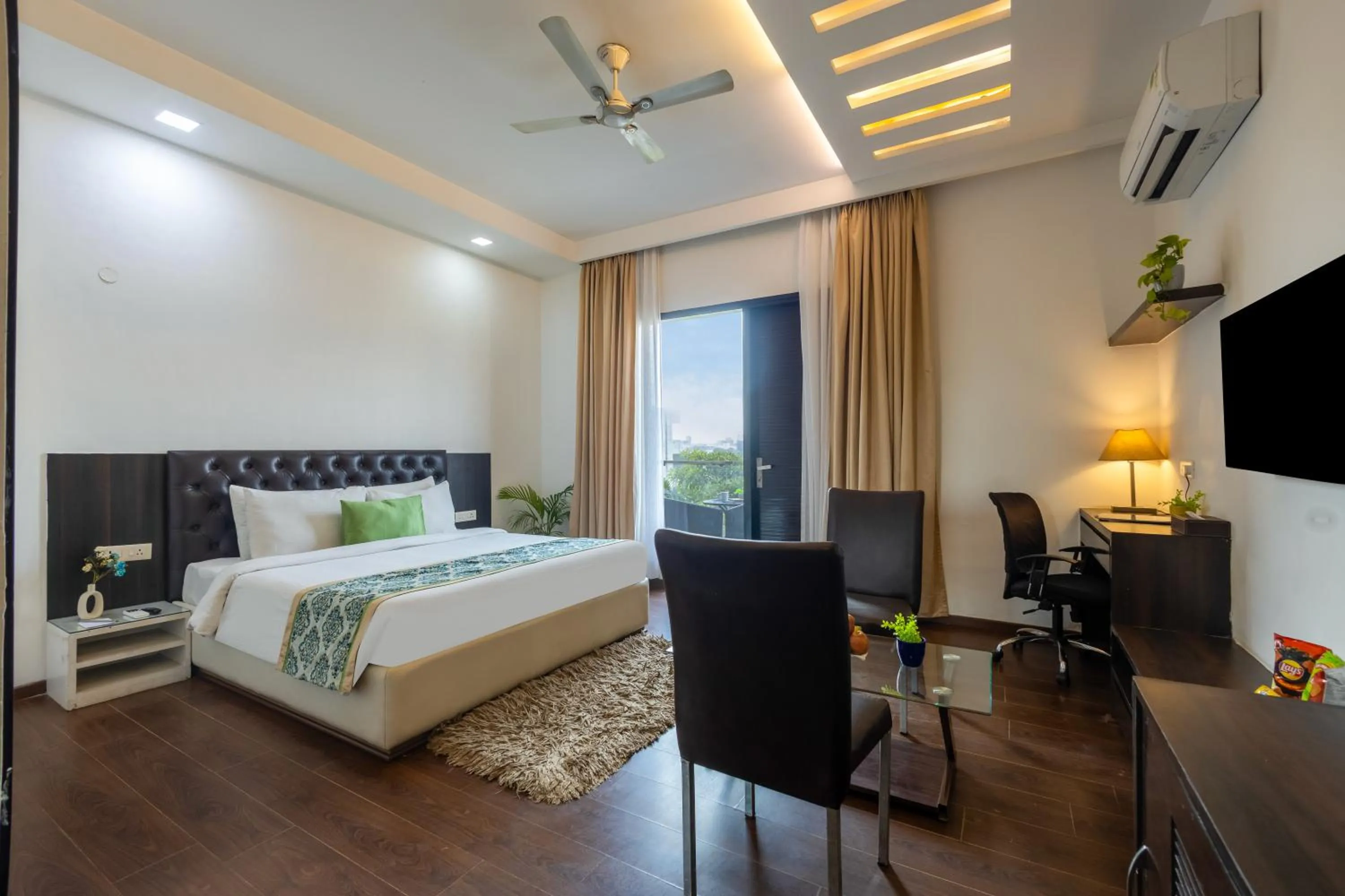 Balcony/Terrace, Bed in Vivid Boutique Hotel, Medanta, Gurugram