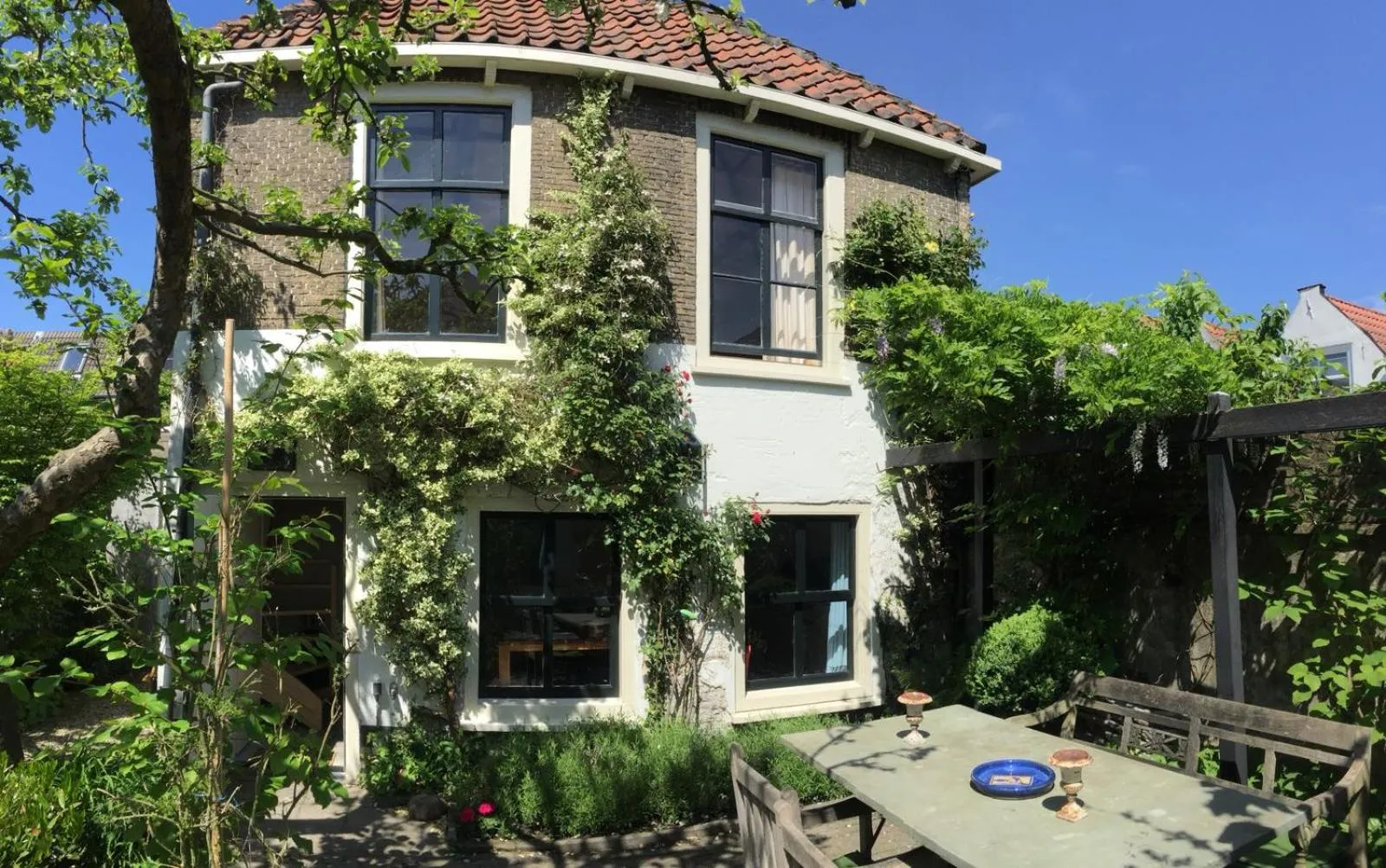 Patio in Apple Tree Cottage - charming home at beautiful canal in our idyllic garden