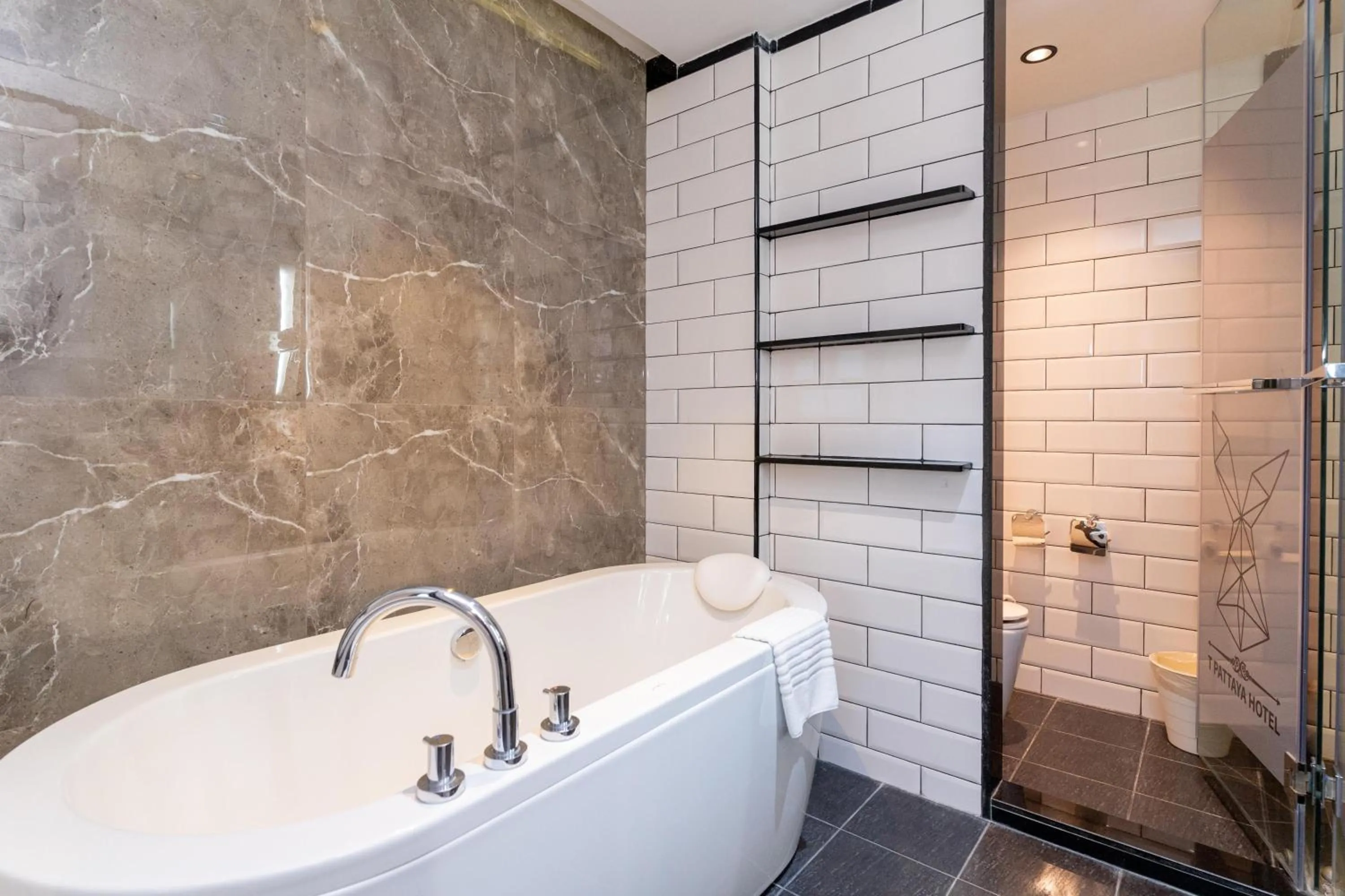 Bathroom in SureStay Plus by Best Western T Pattaya