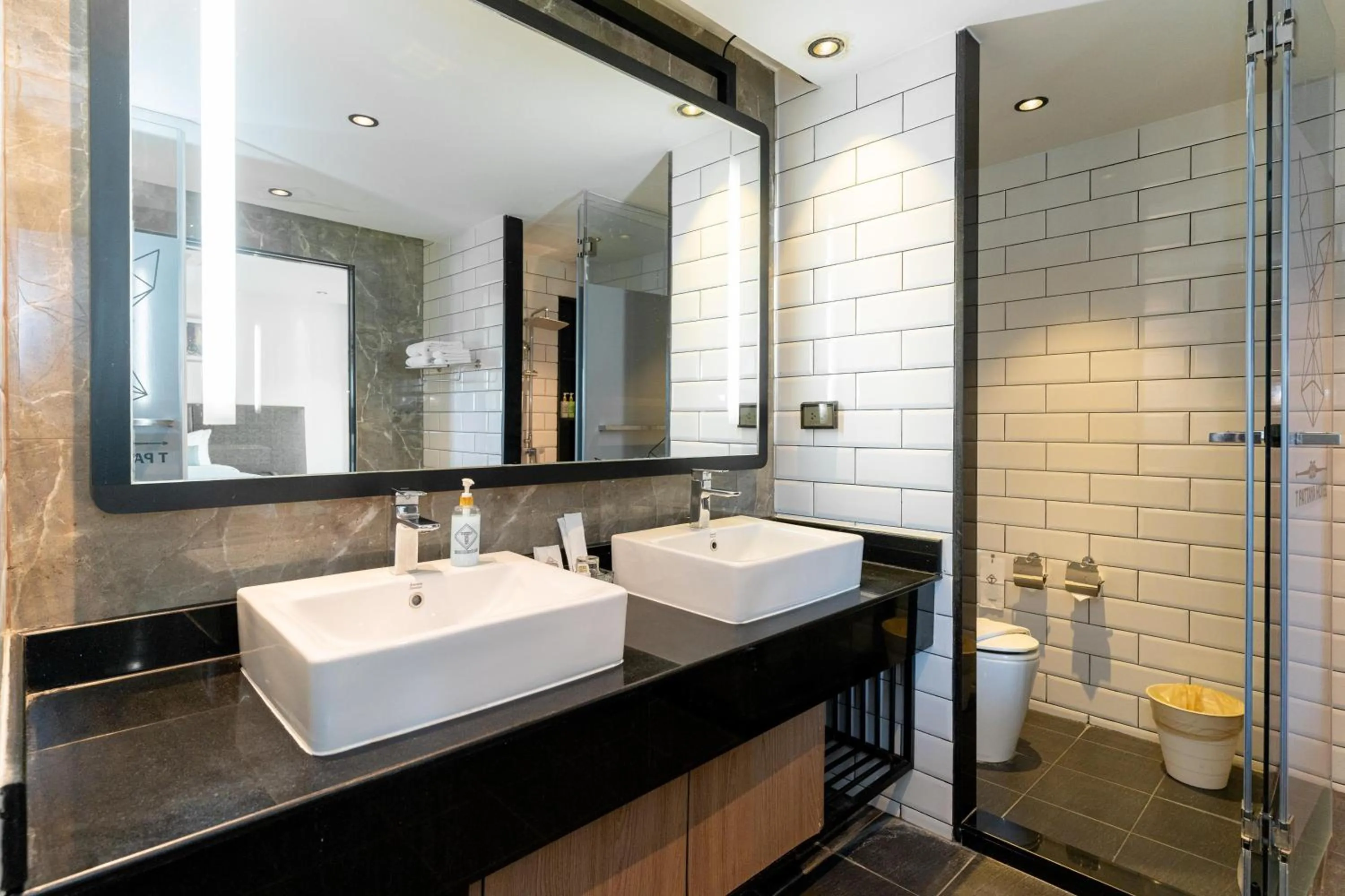 Bathroom in SureStay Plus by Best Western T Pattaya