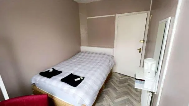 Bed in The Merlin Hotel