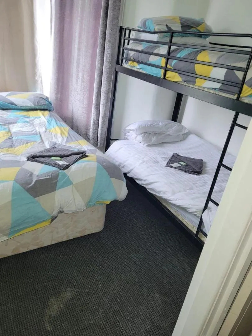 Bed in The Merlin Hotel