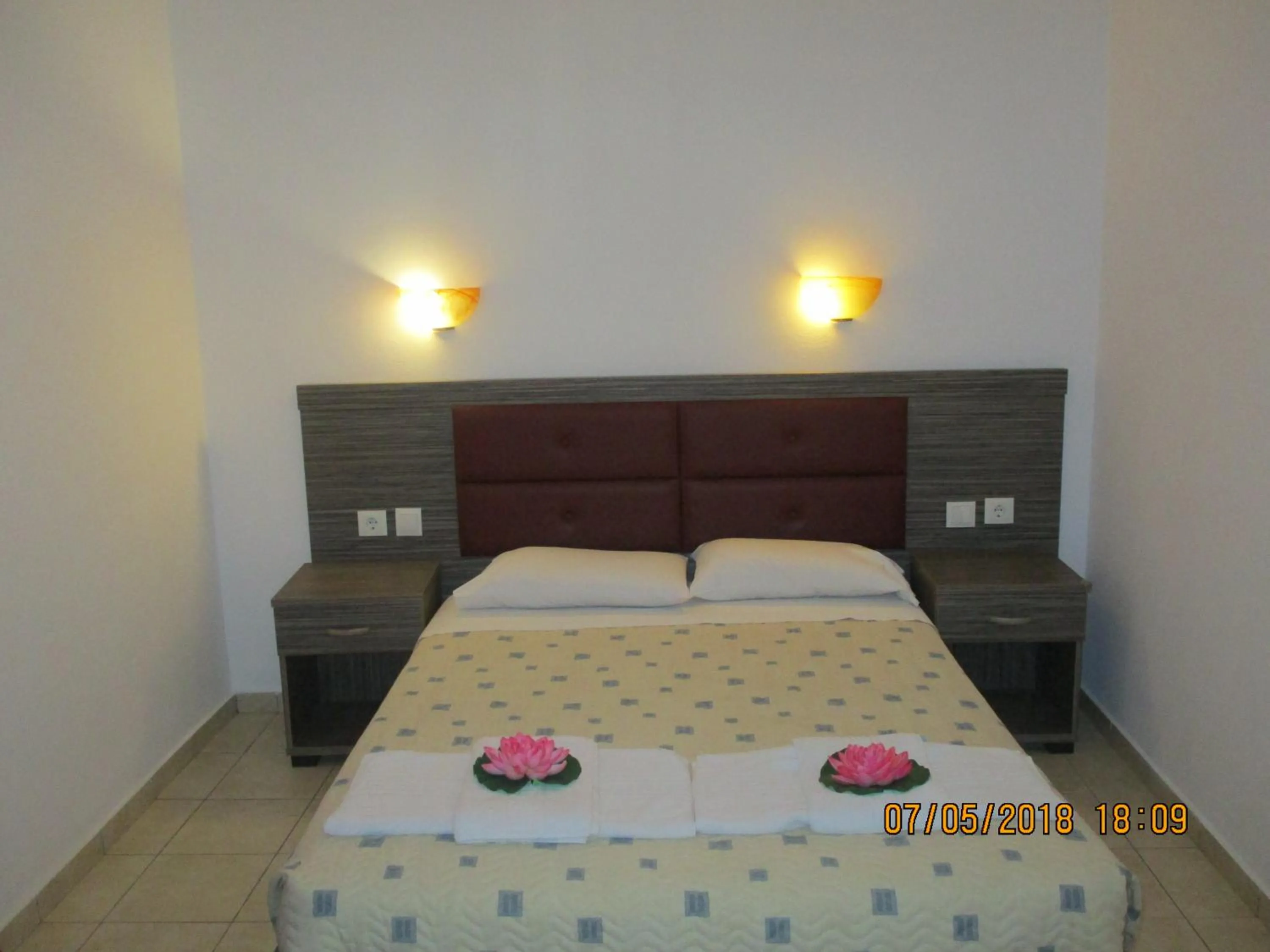 Bed in Gouvia House Luxury Apartments