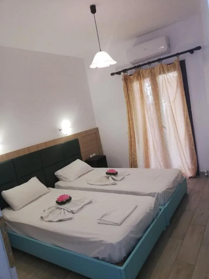 Bed in Gouvia House Luxury Apartments