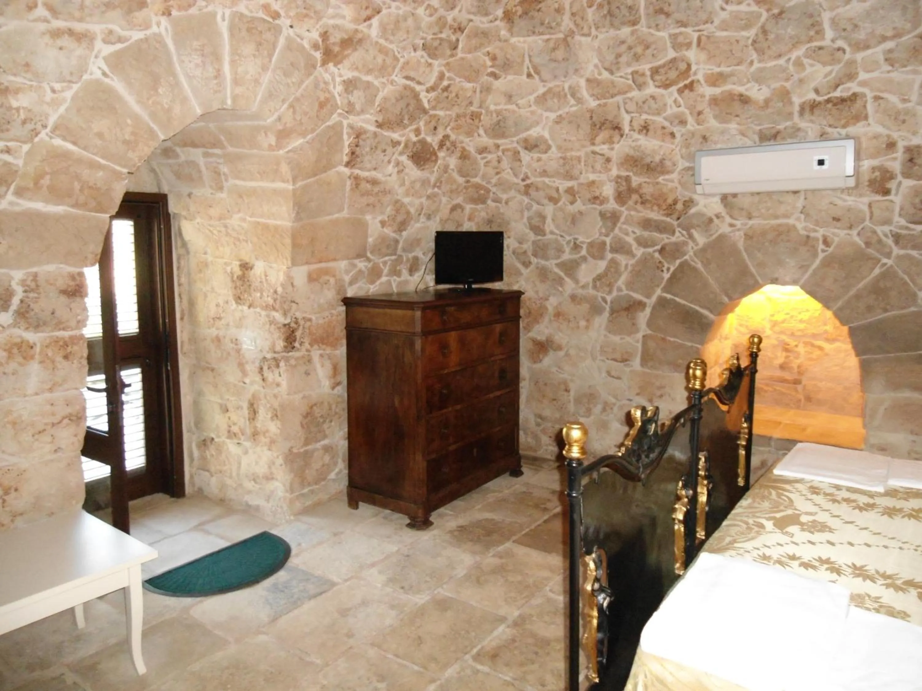 Decorative detail, Bed in Tenuta Pigliano Hotel