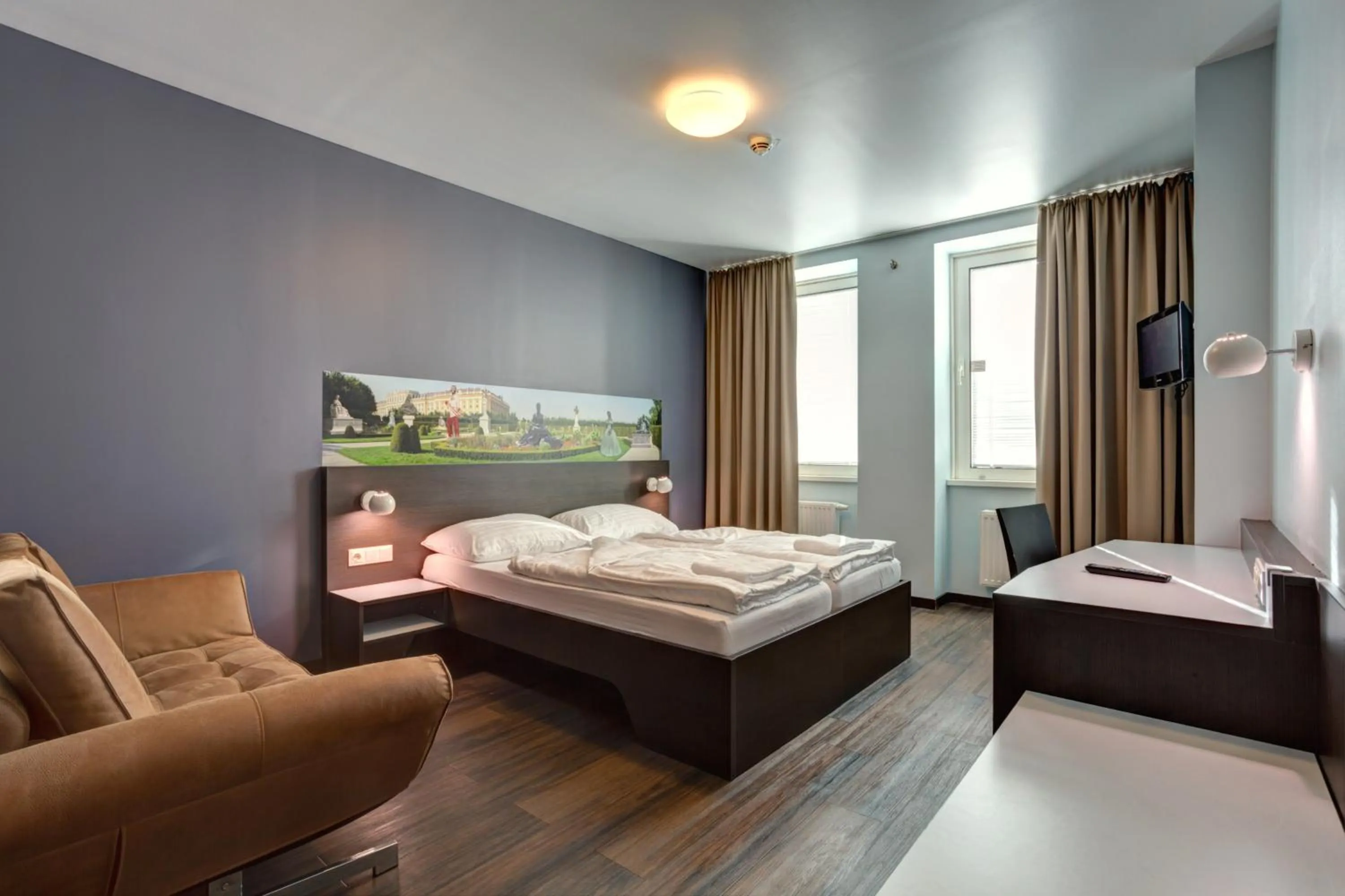 Photo of the whole room, Bed in MEININGER Hotel Wien Downtown Sissi