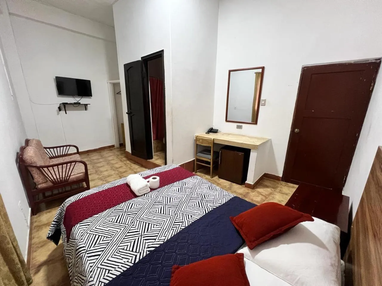 Bed in Atlantic Suites Hotel