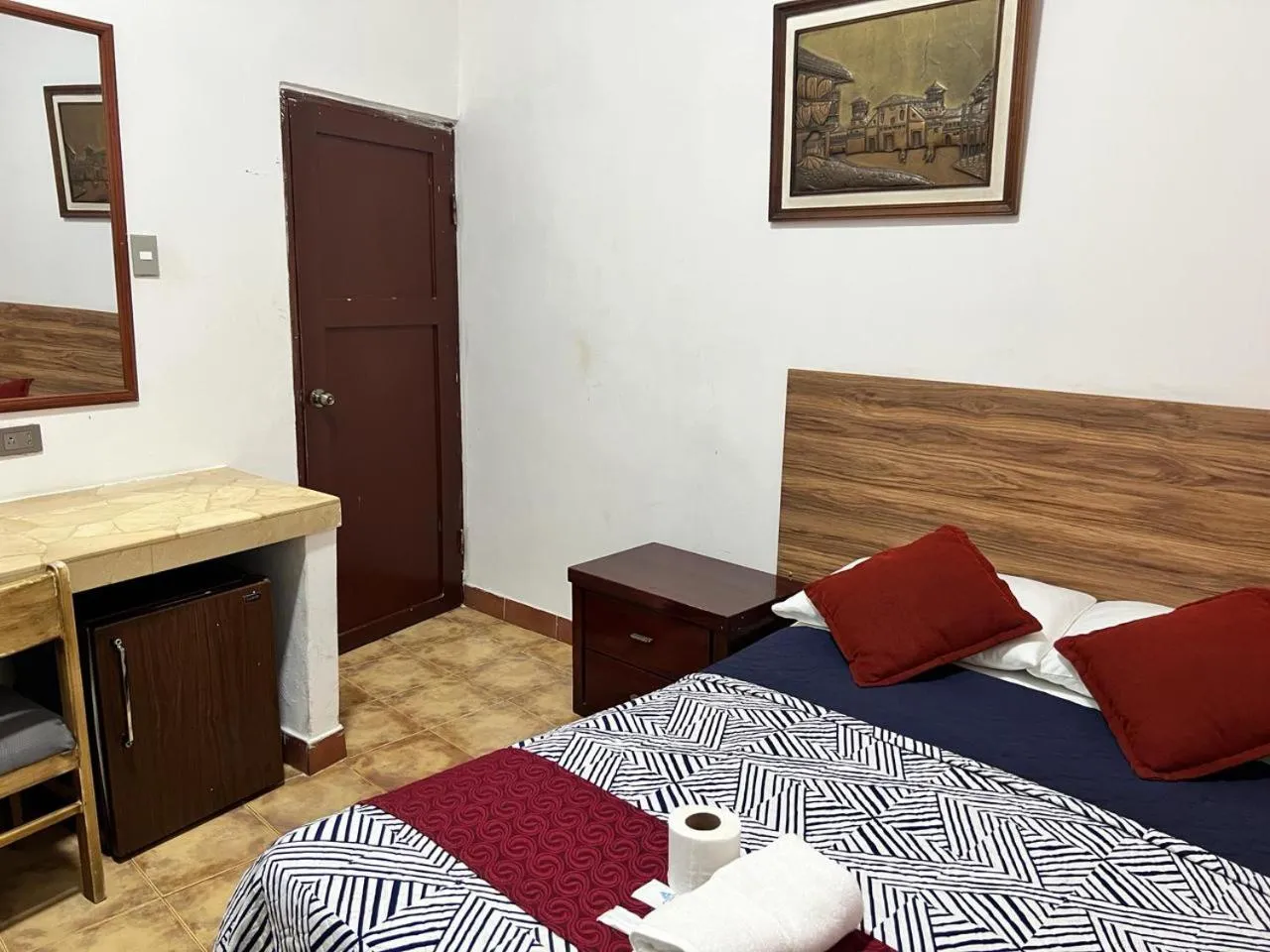 Bed in Atlantic Suites Hotel