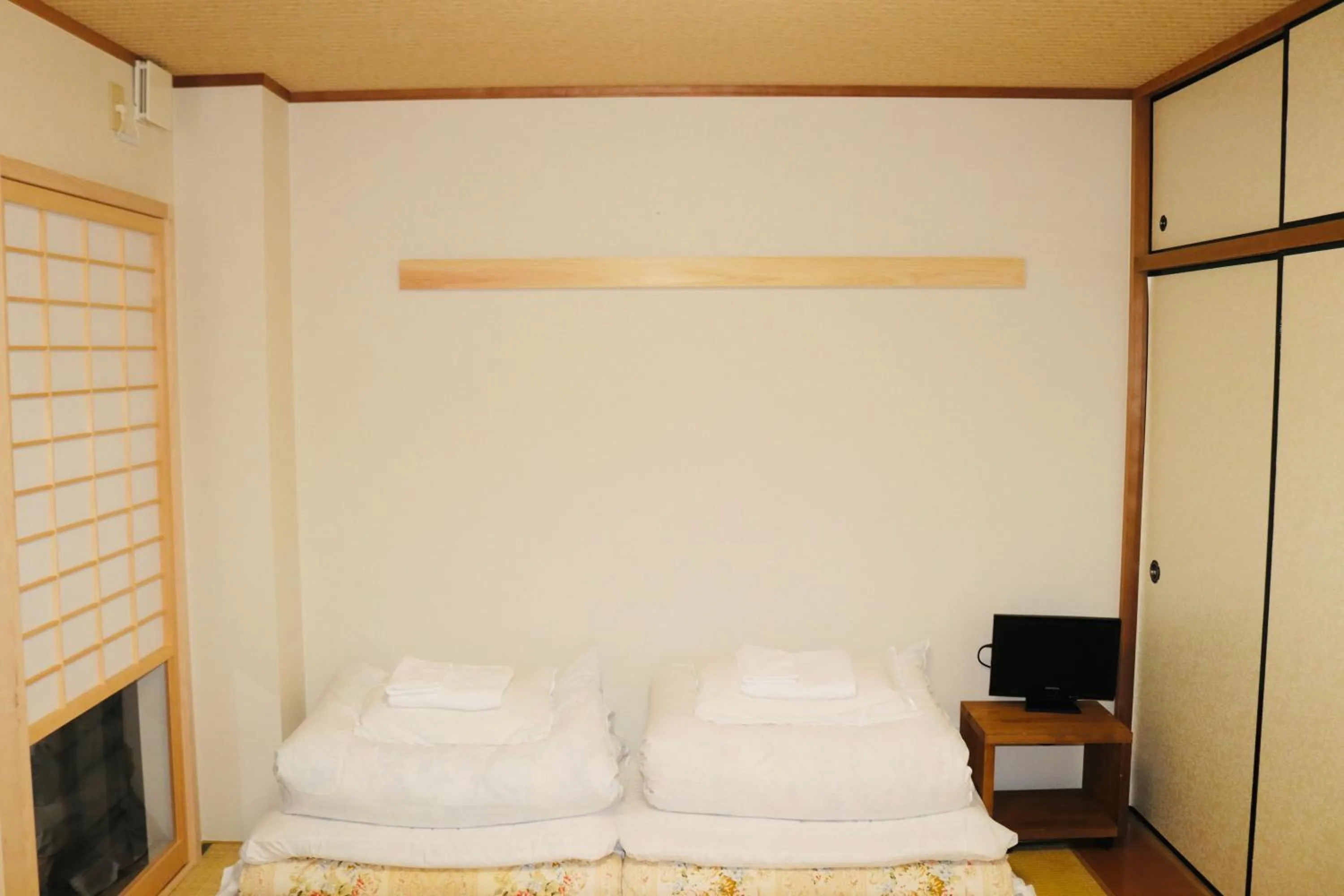 Bed in Ikoi-no-Ie Guesthouse