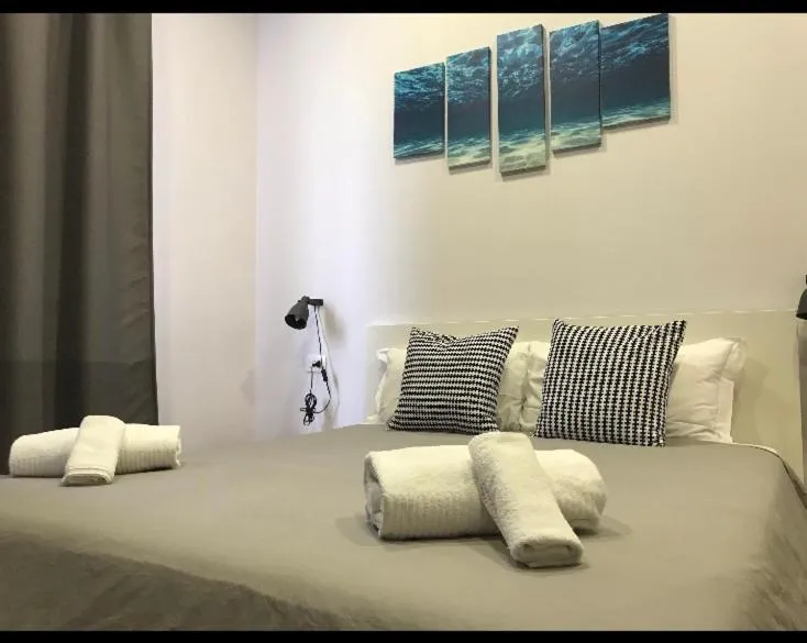 Bed in 2Naples Rooms