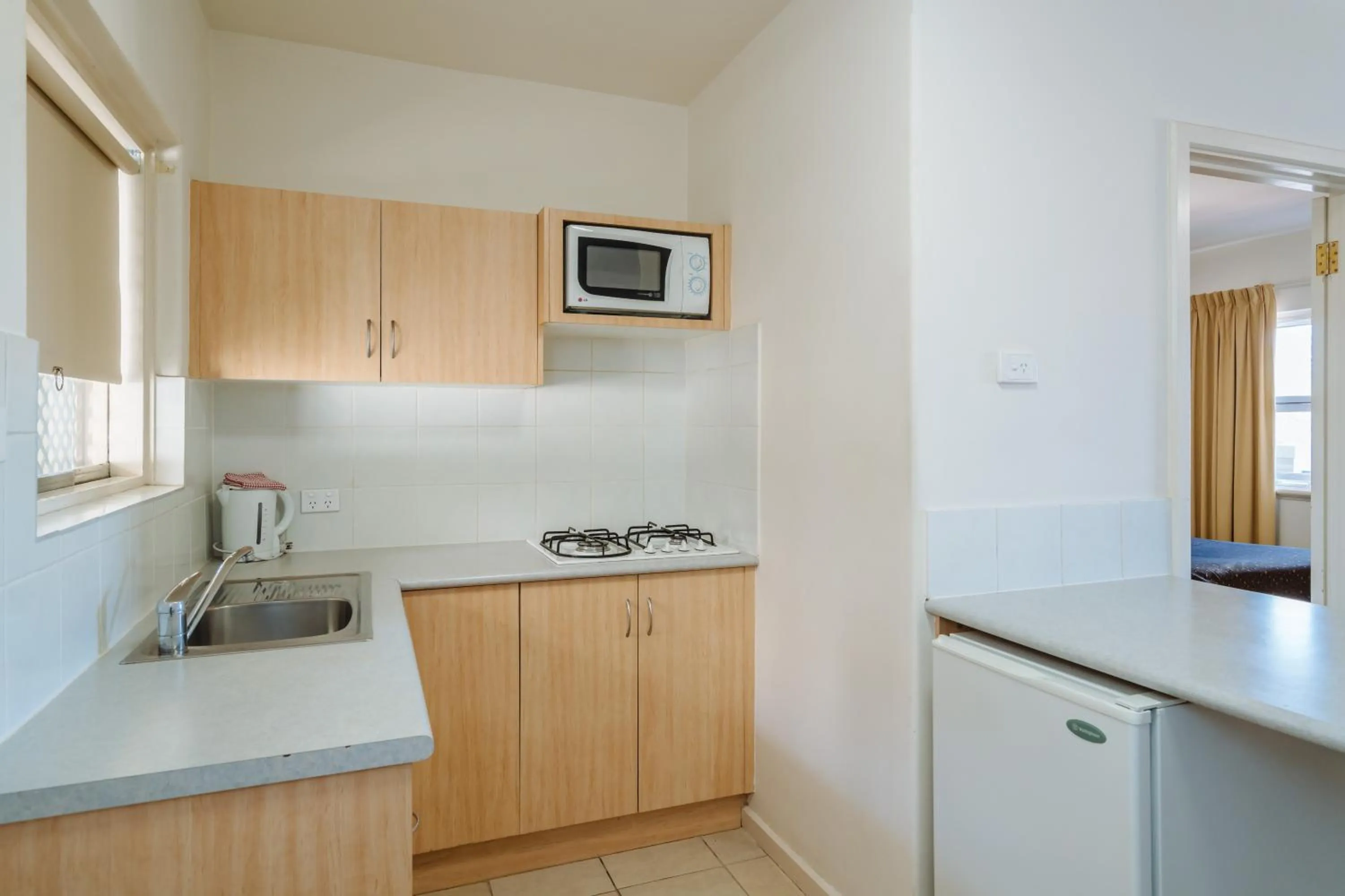 Kitchen or kitchenette in Canning Bridge Auto Lodge