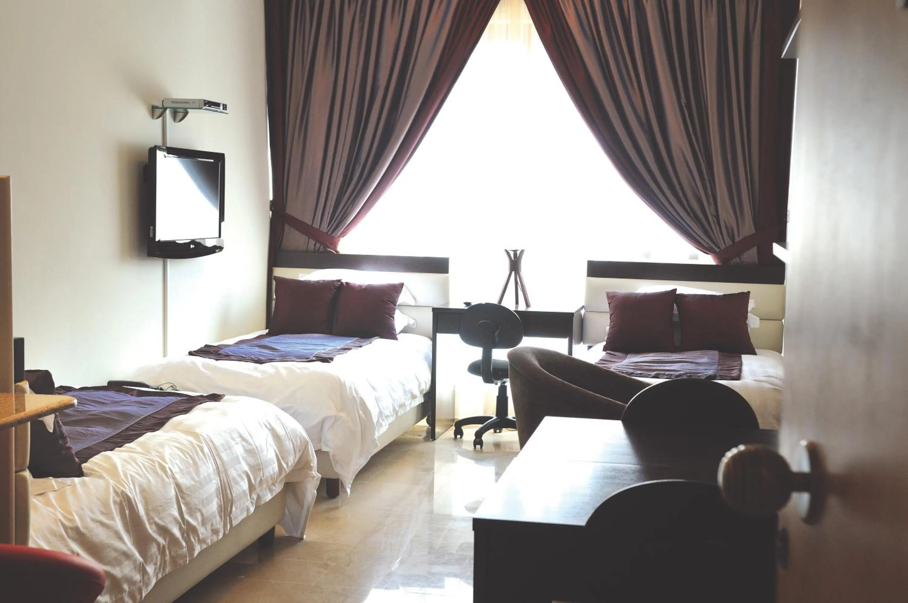 Bed in Bliss 3000 Furnished Studios