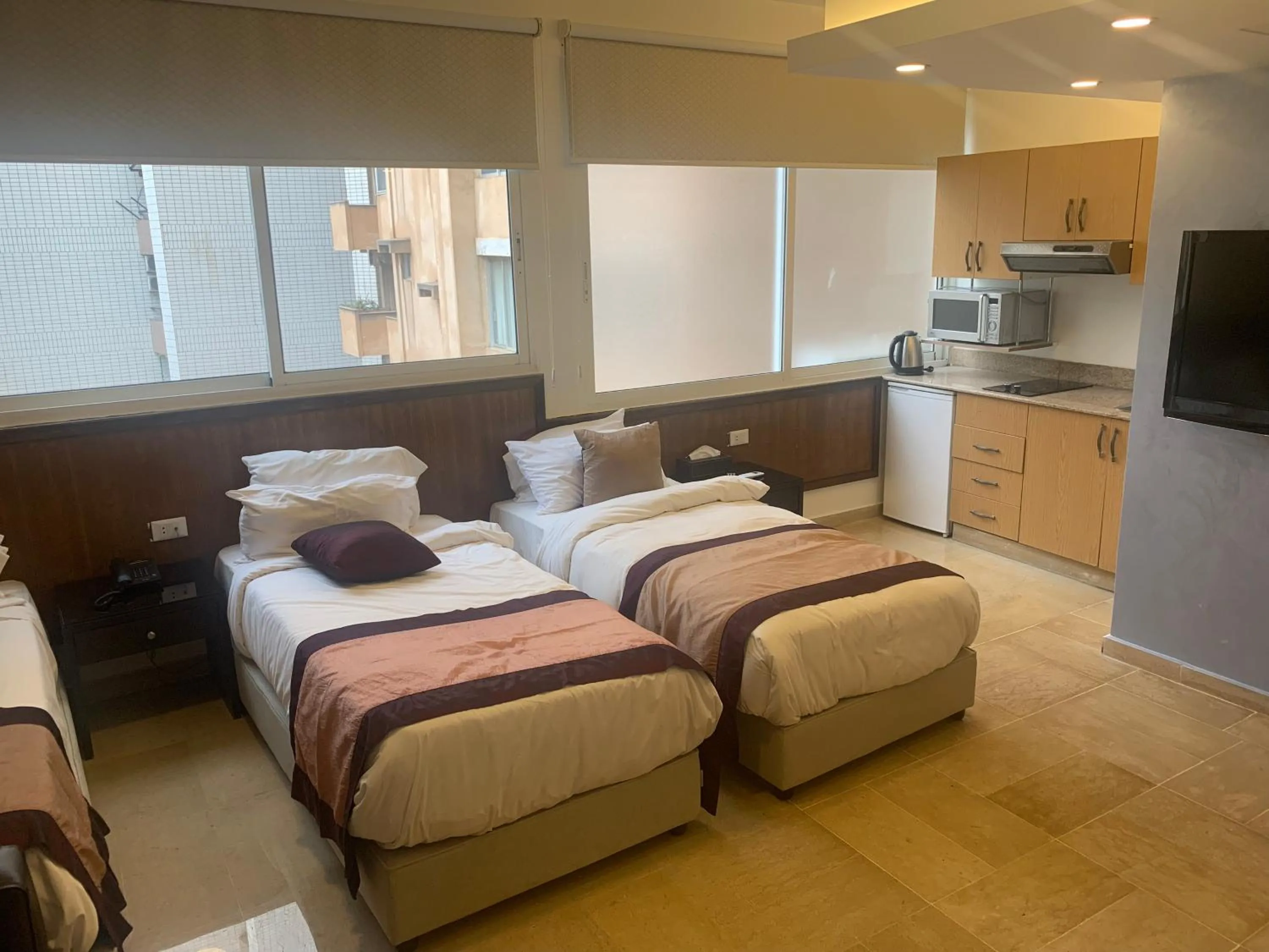 TV and multimedia, Bed in Bliss 3000 Furnished Studios