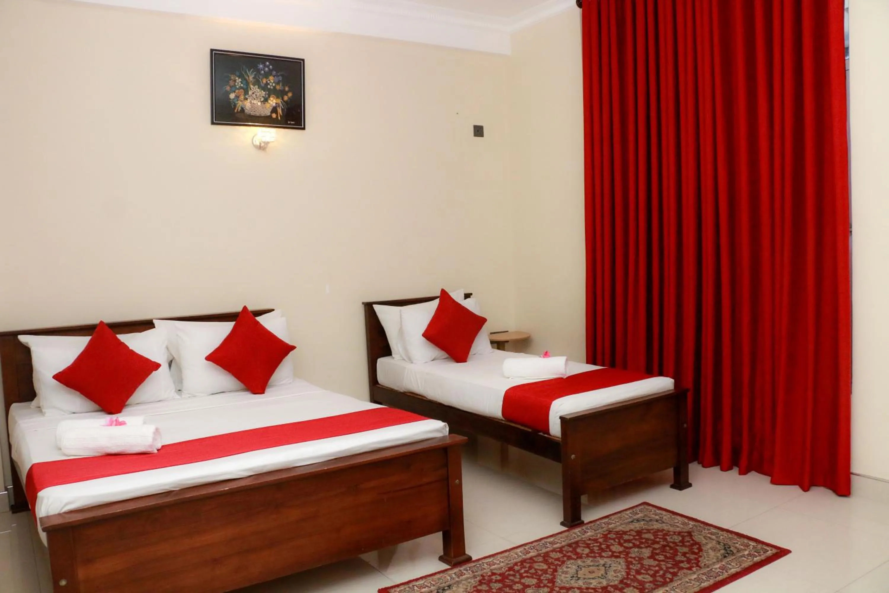 Bed in Queens Beach Hotel