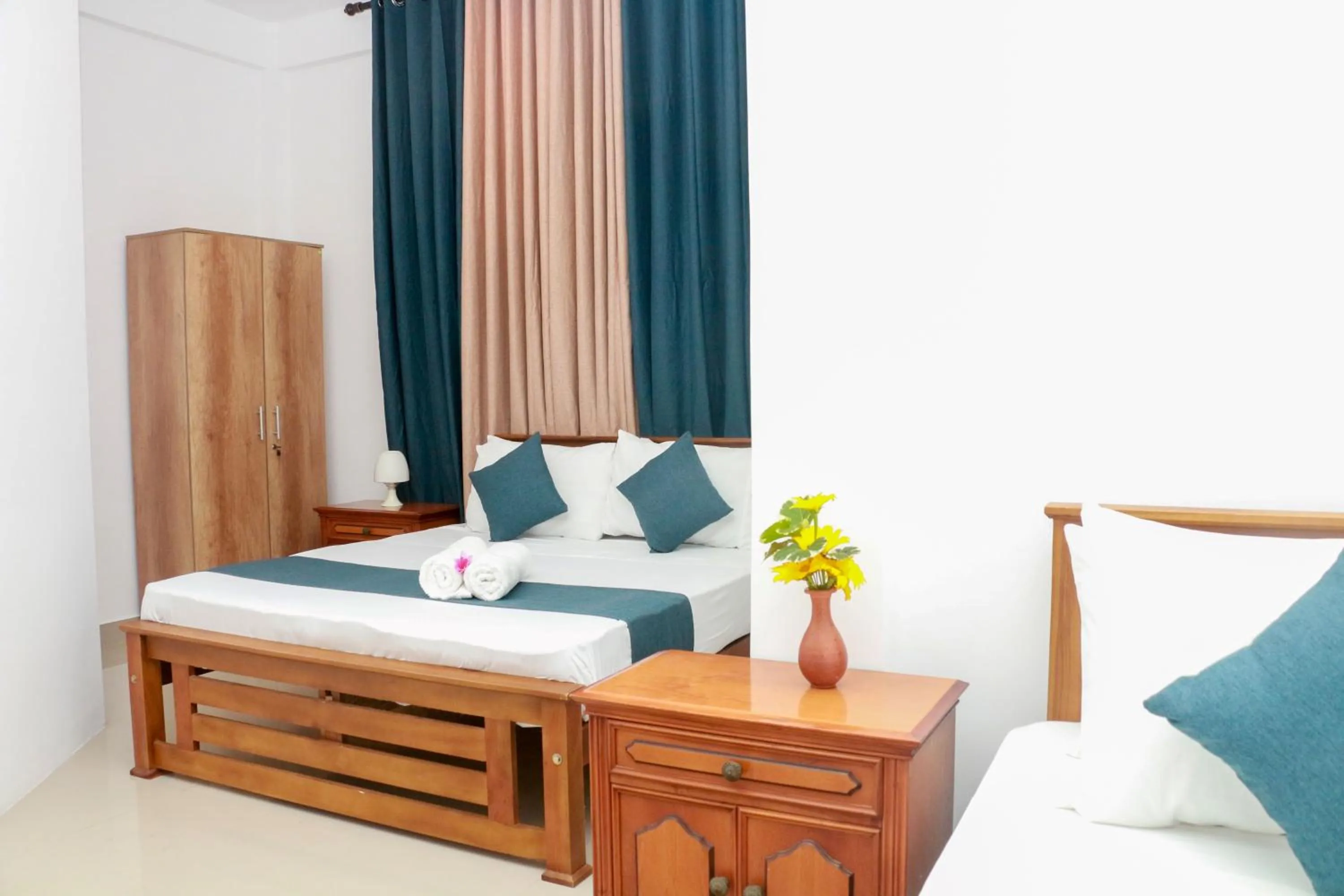 Bed in Queens Beach Hotel