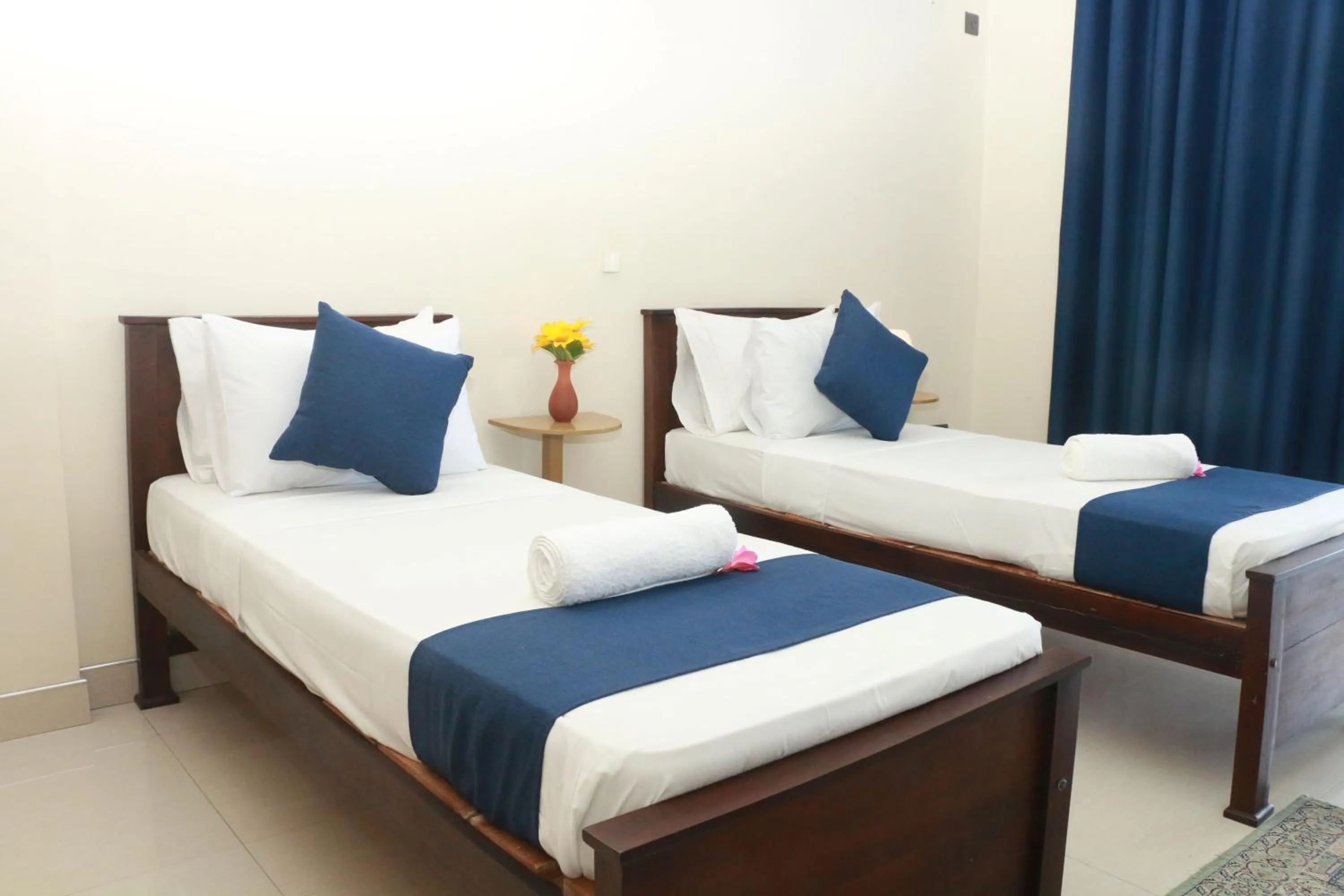 Bed in Queens Beach Hotel