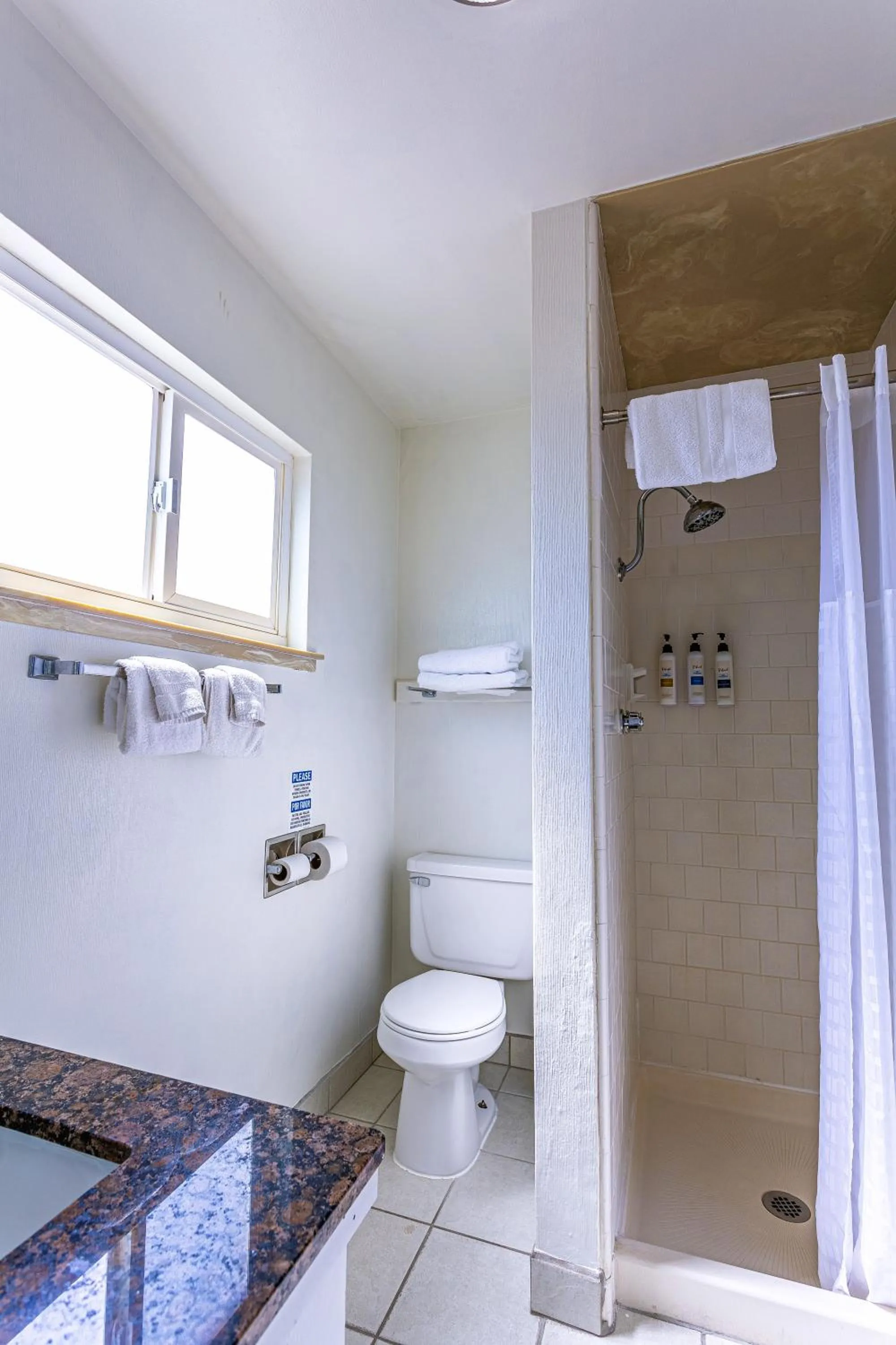 Toilet in Coastal Breeze Inn