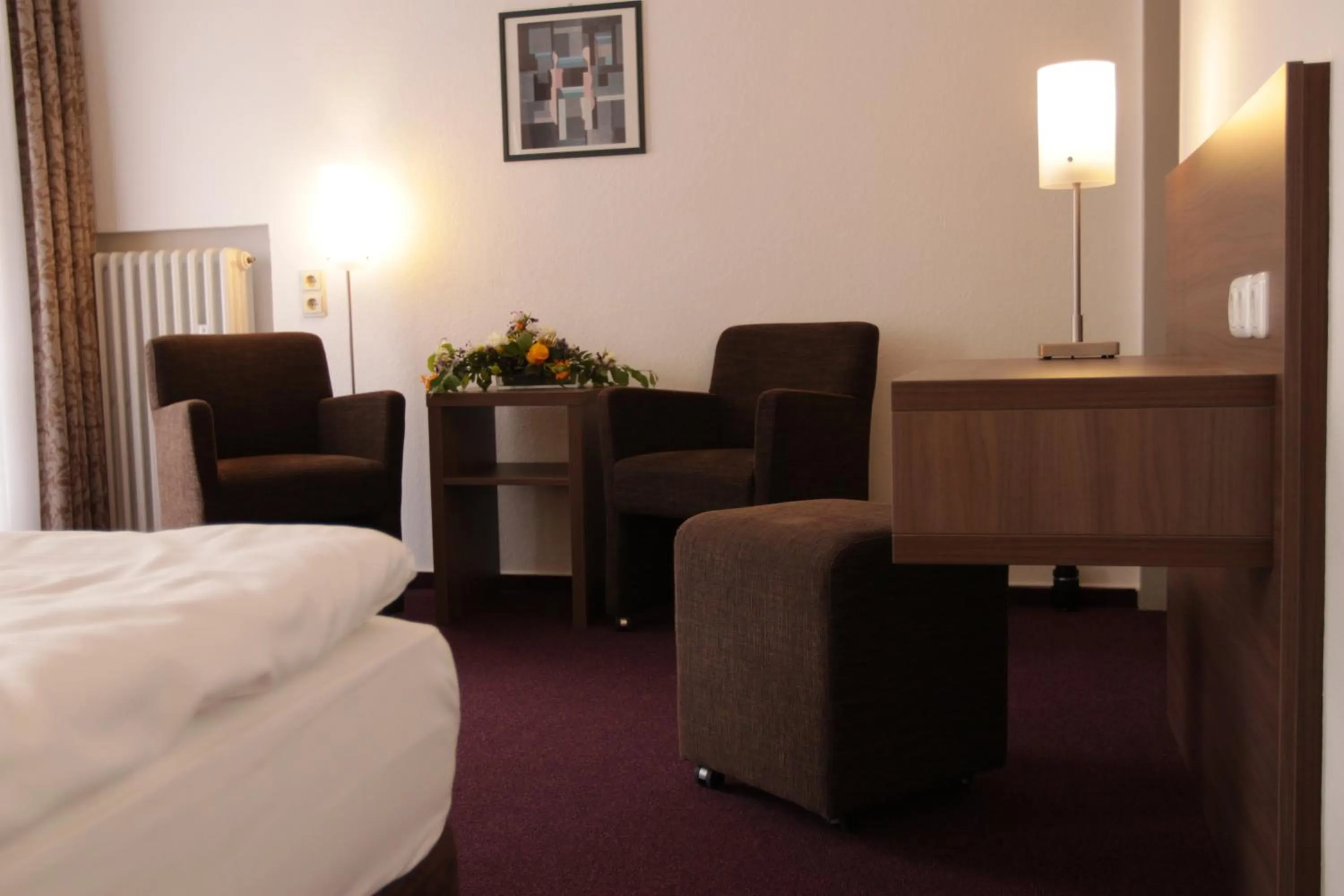 Seating area, Bed in Hotel Buntrock