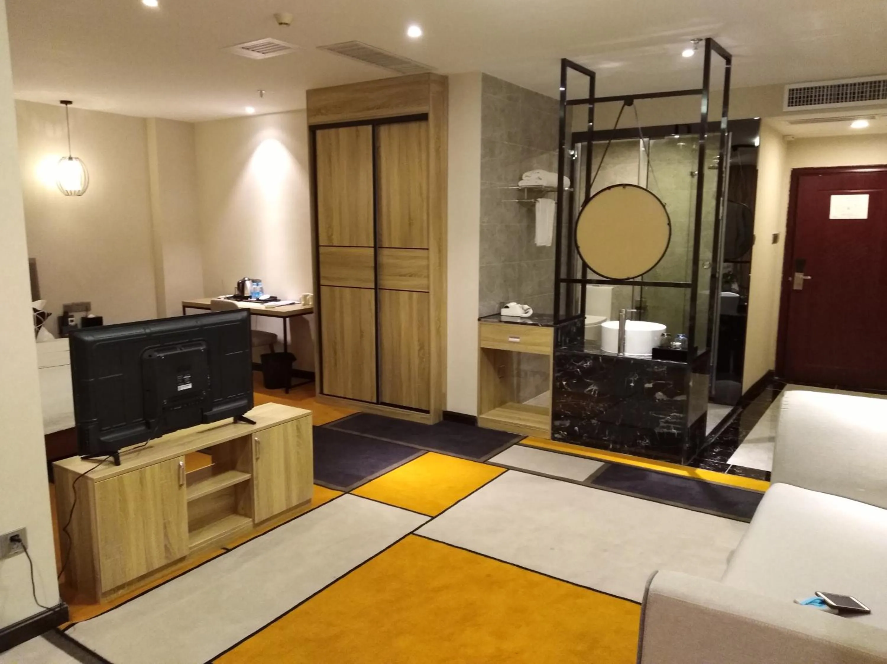 Living room, Bed in Guangzhou Homies Hotel