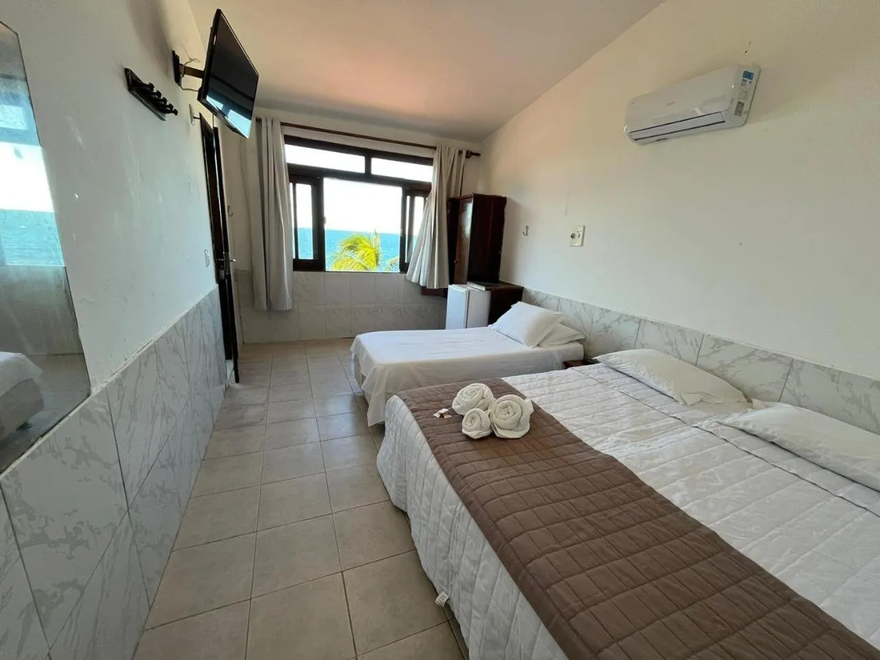 Bed in Pousada Farol do Morro