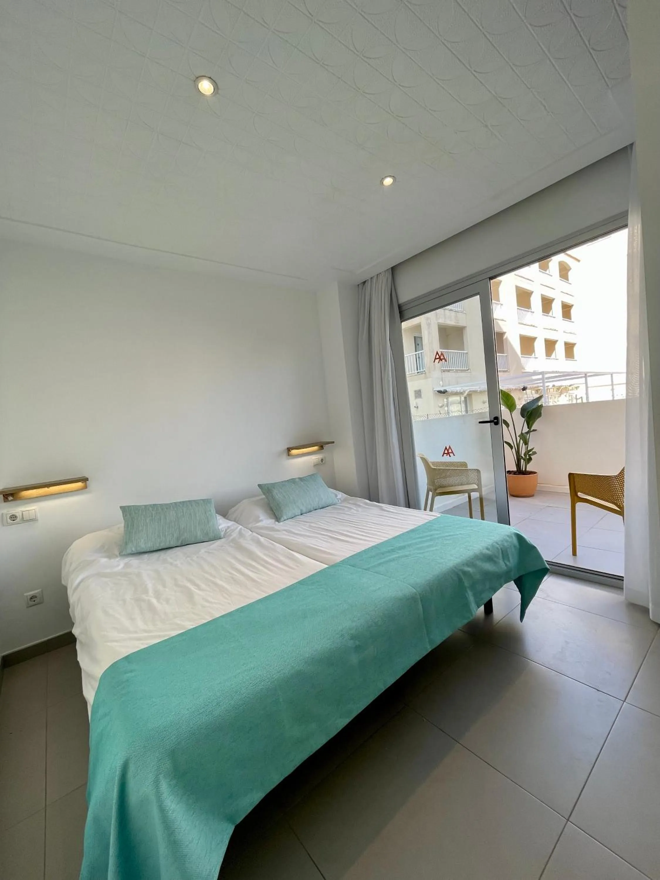 Bed in Apartaments La Perla Negra