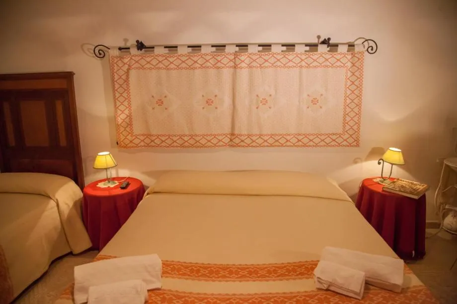 Bed in Su Cantaru Guesthouse