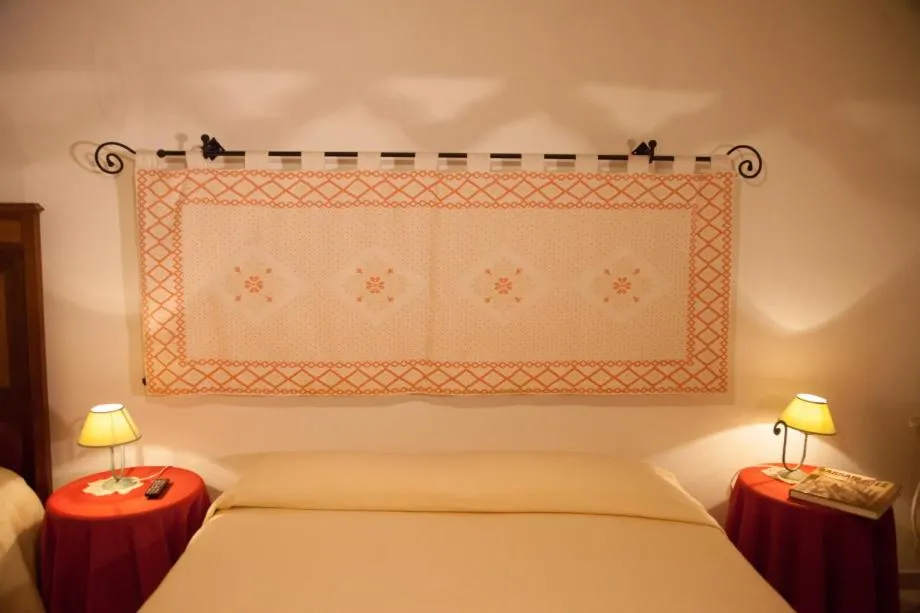 Bed in Su Cantaru Guesthouse