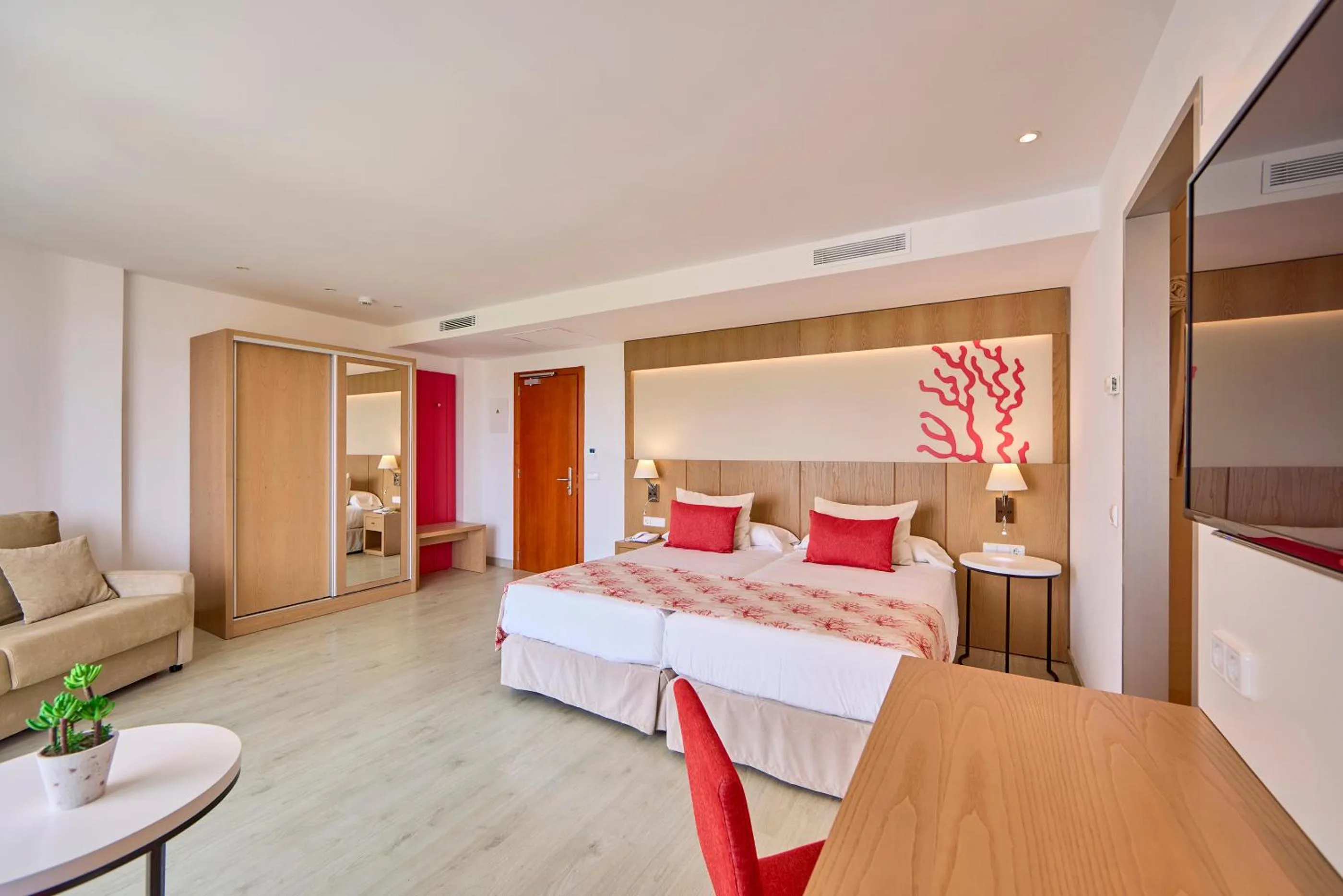 Bed in Universal Hotel Perla