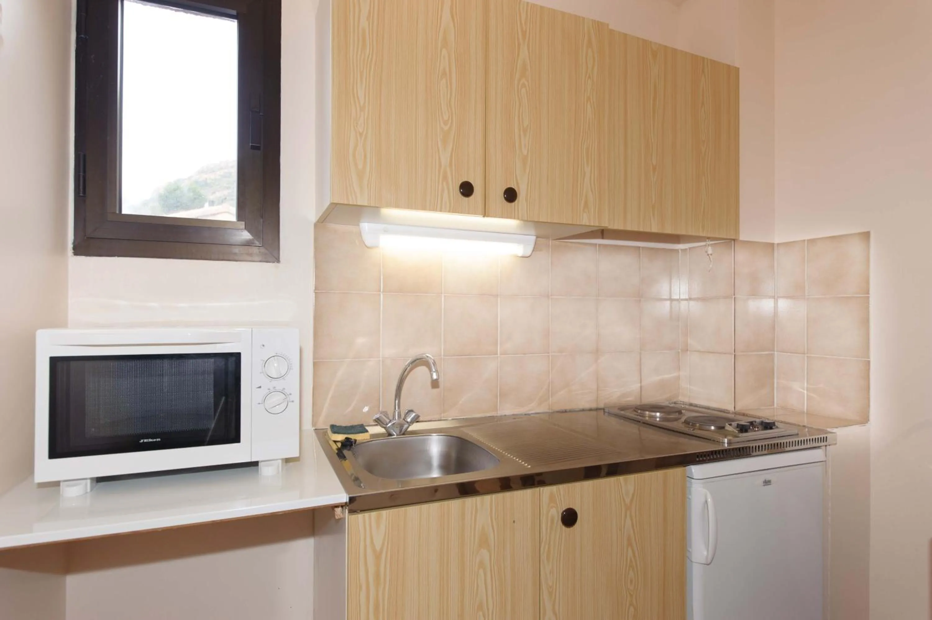 Kitchen or kitchenette in Hotel et Résidence Cala di sole