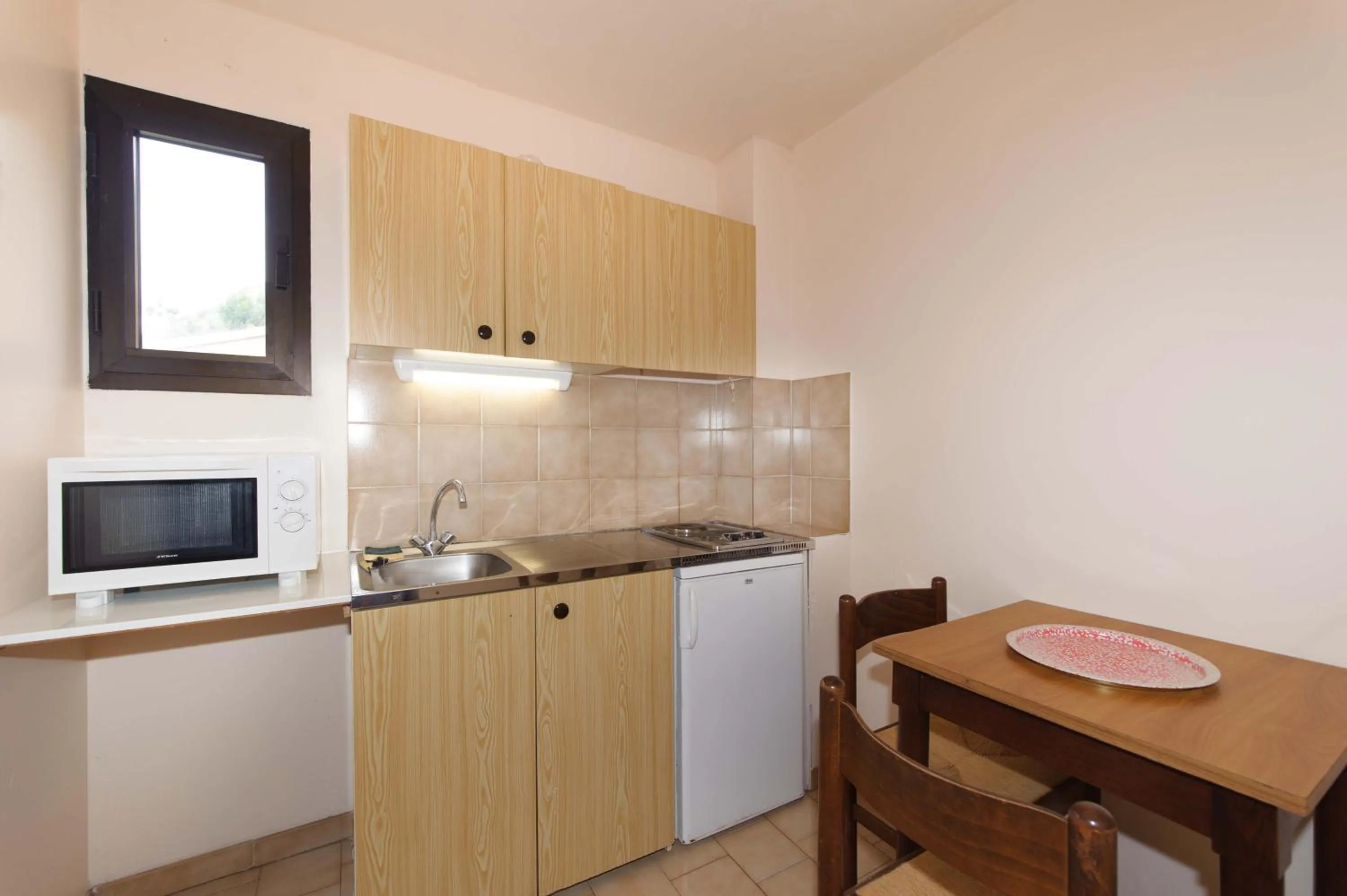 Kitchen or kitchenette in Hotel et Résidence Cala di sole