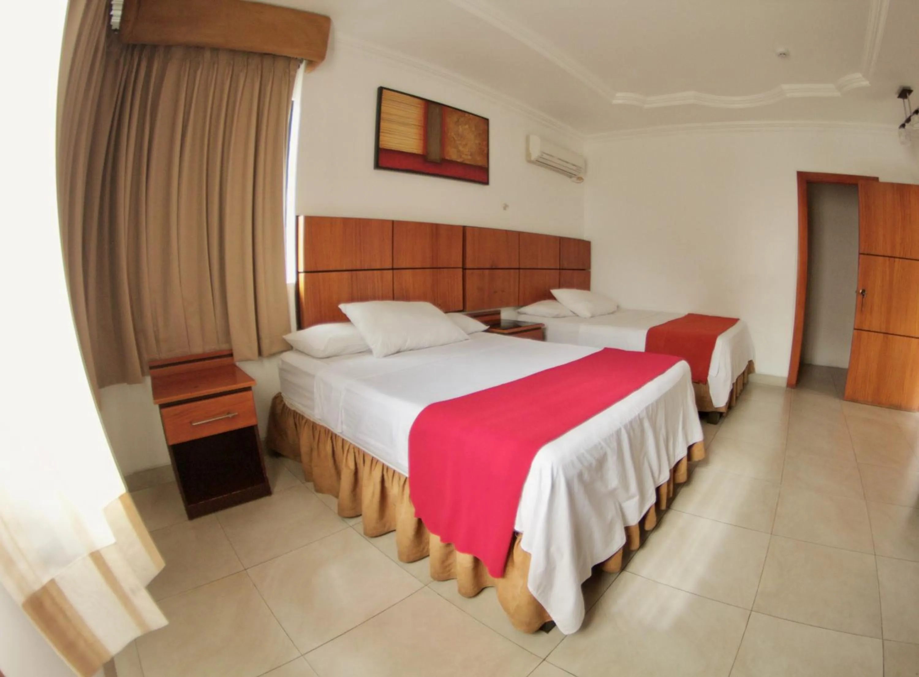 Photo of the whole room, Bed in Hoteles en Guayaquil - Suites Guayaquil Cerca del Aeropuerto