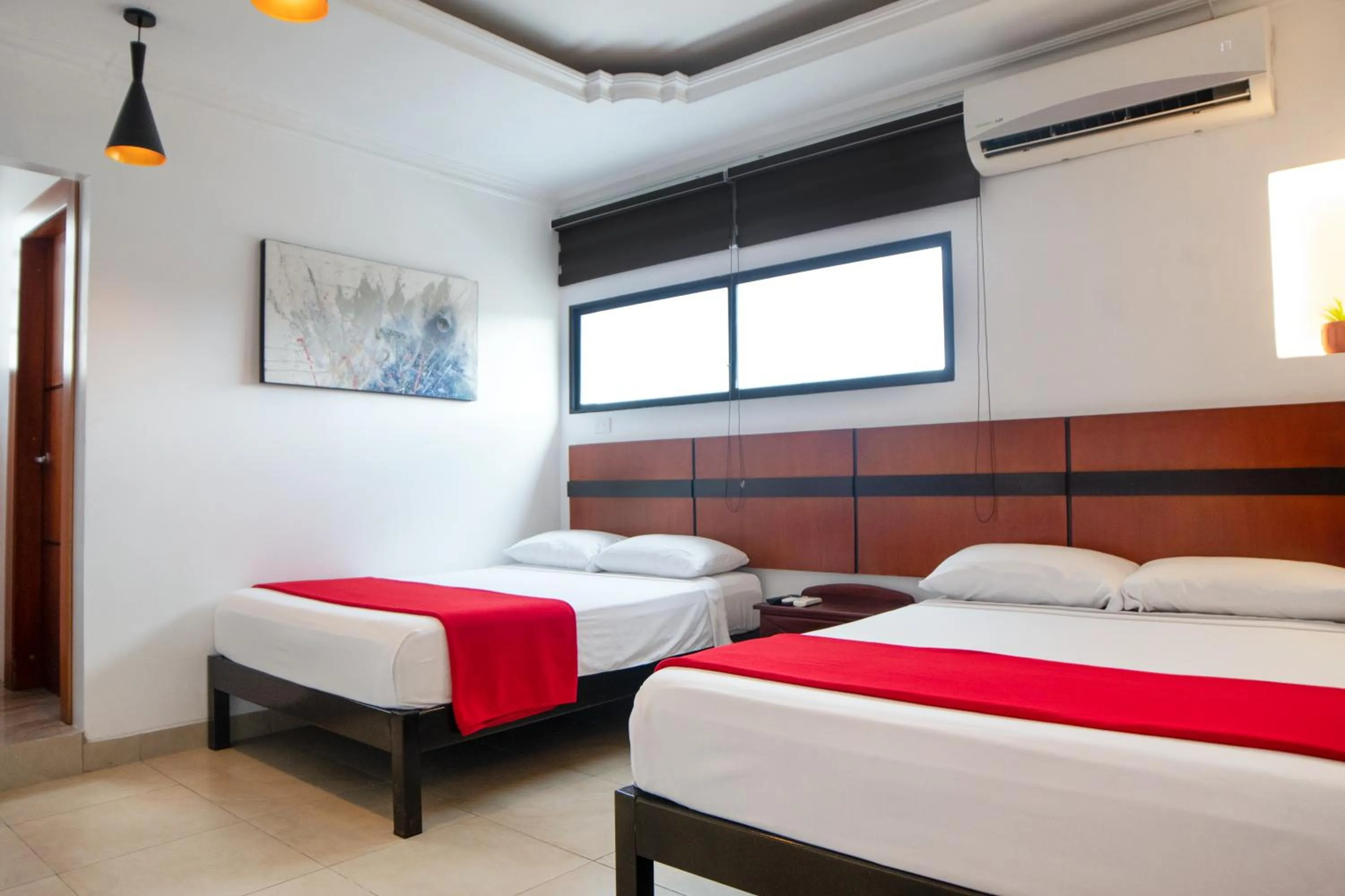 TV and multimedia, Bed in Hoteles en Guayaquil - Suites Guayaquil Cerca del Aeropuerto