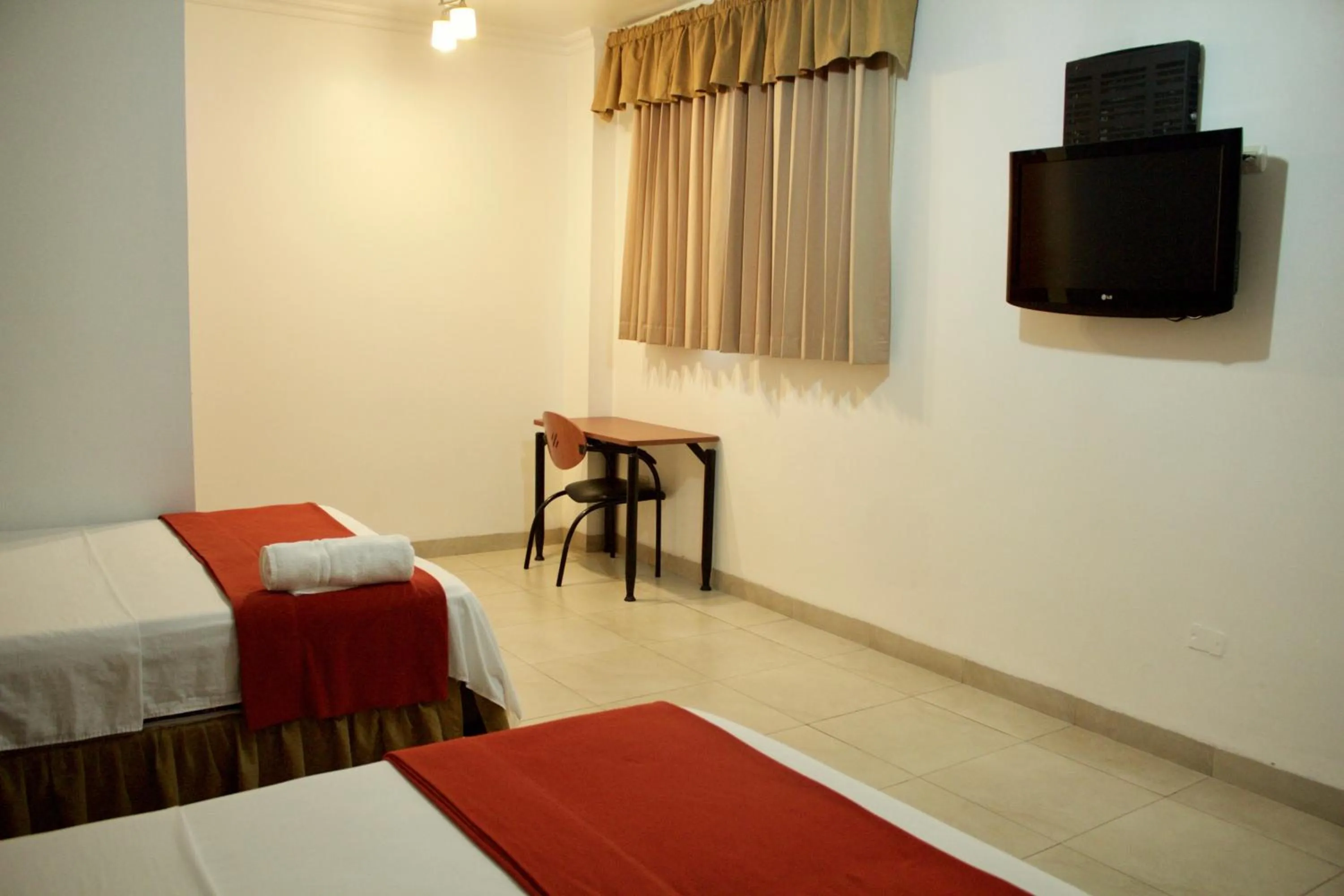 Bed in Hoteles en Guayaquil - Suites Guayaquil Cerca del Aeropuerto