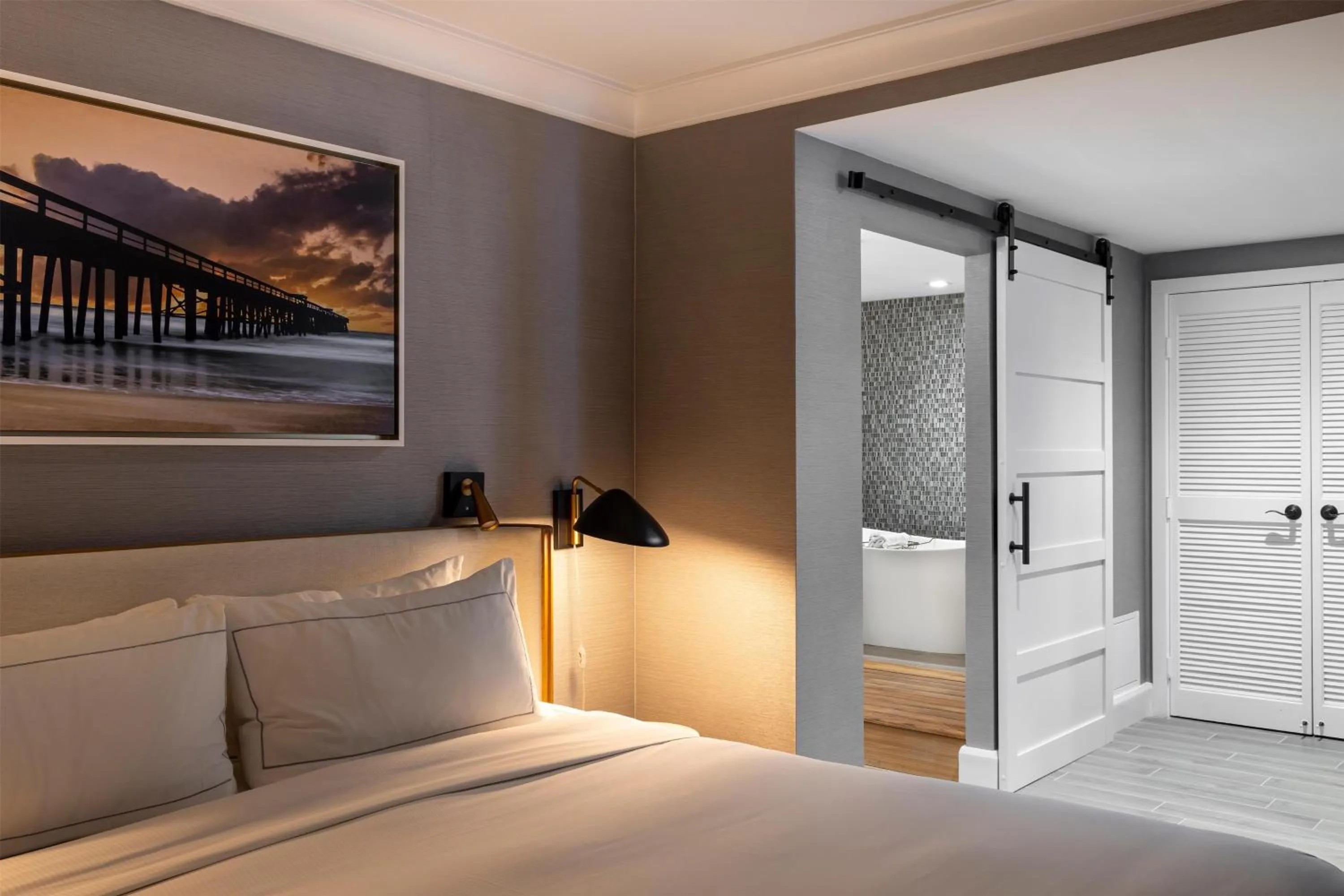 Bathroom, Bed in The Waterfront Beach Resort, A Hilton Hotel