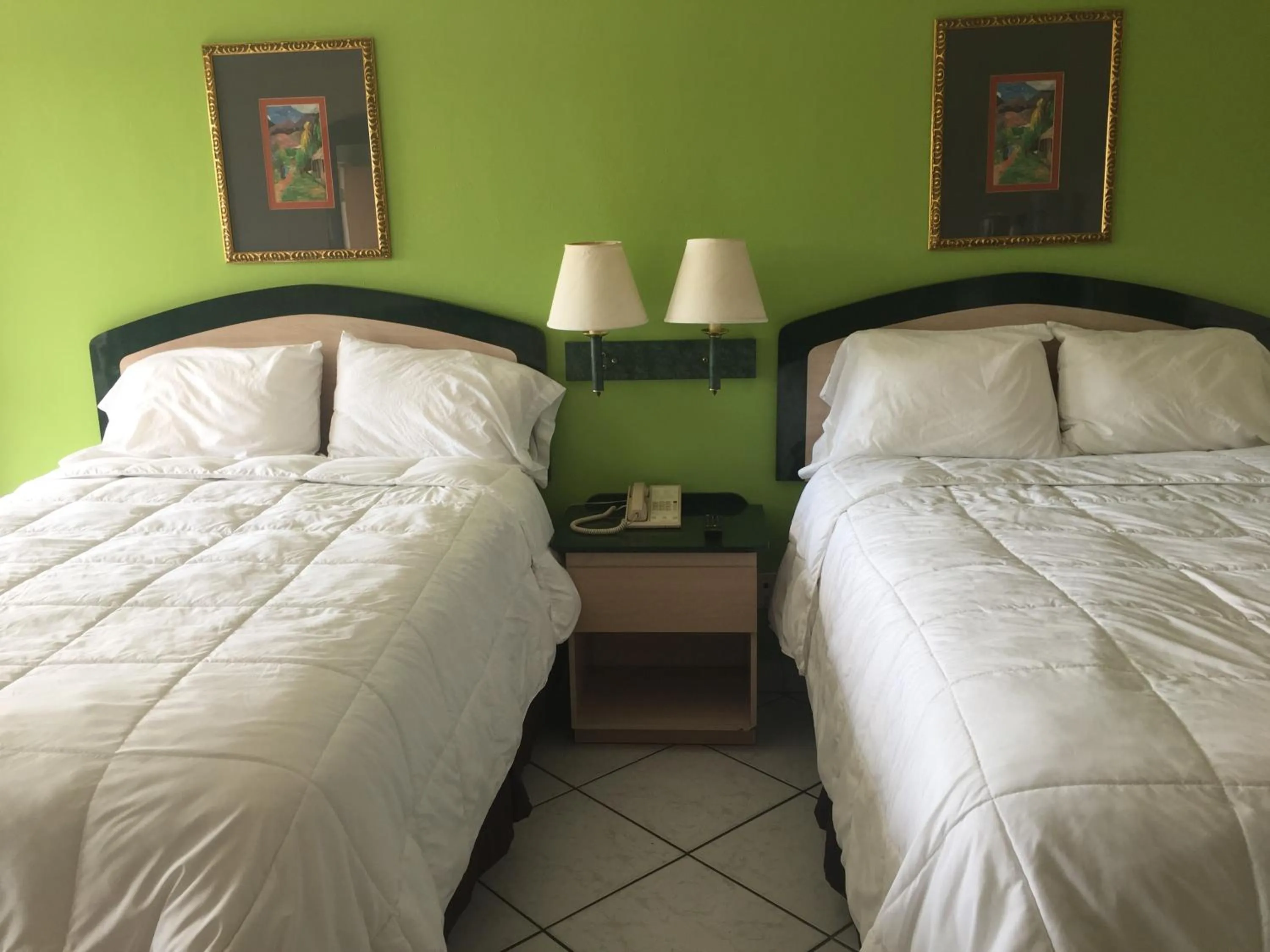 Bed in Curtis Inn & Suites