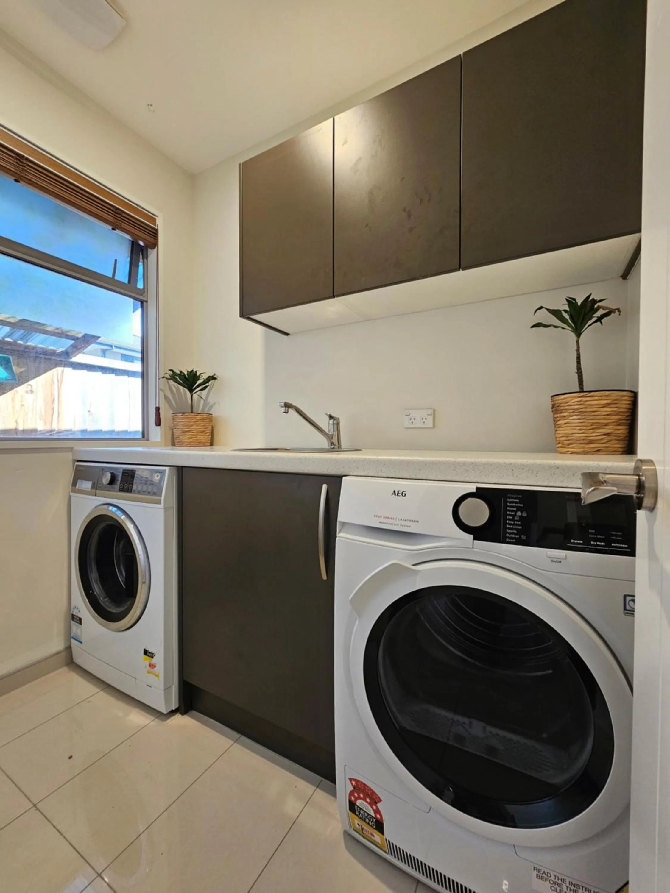 washing machine in Azena Suites & Apartment
