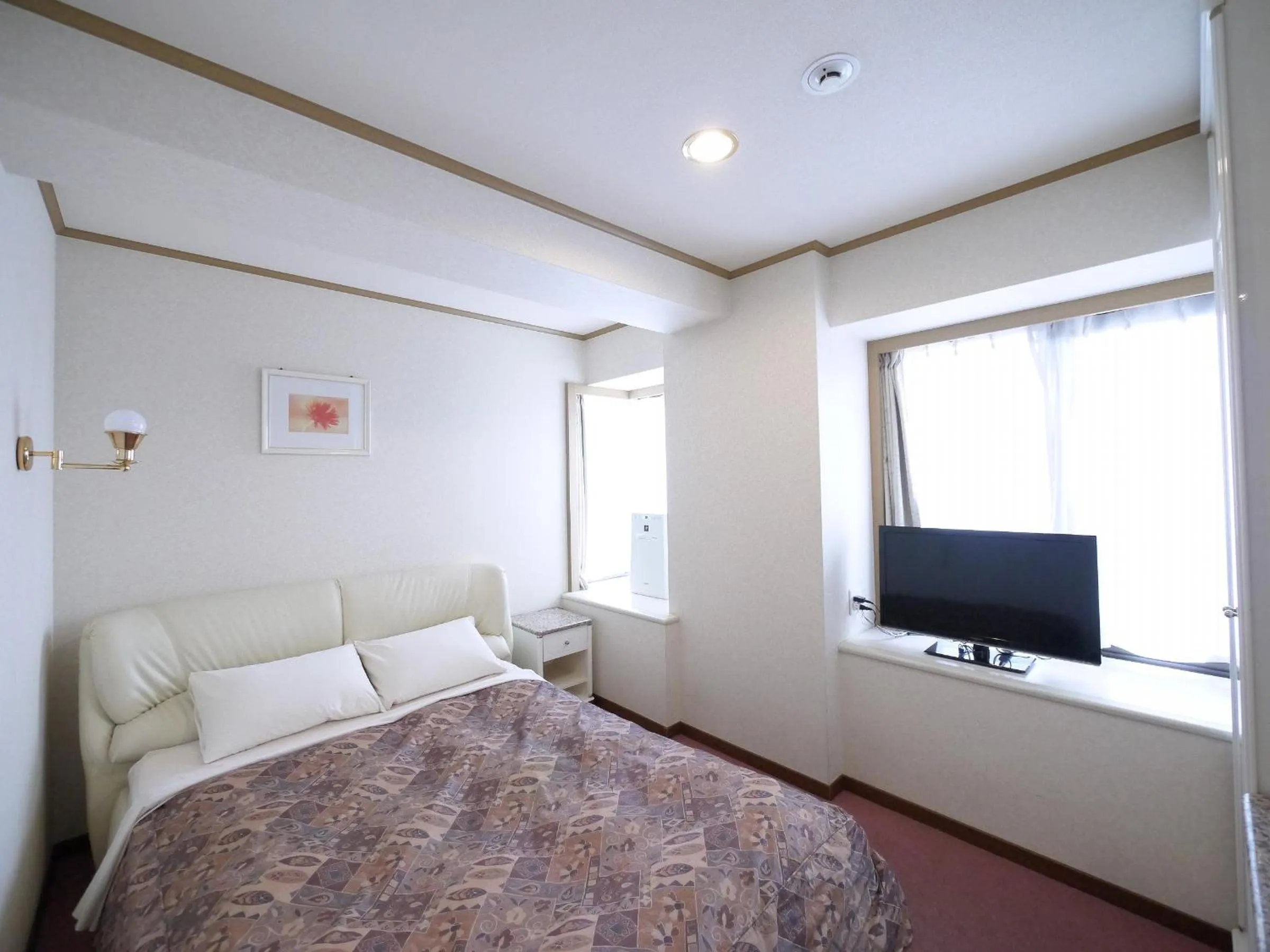 Photo of the whole room, Bed in U-Community Hotel