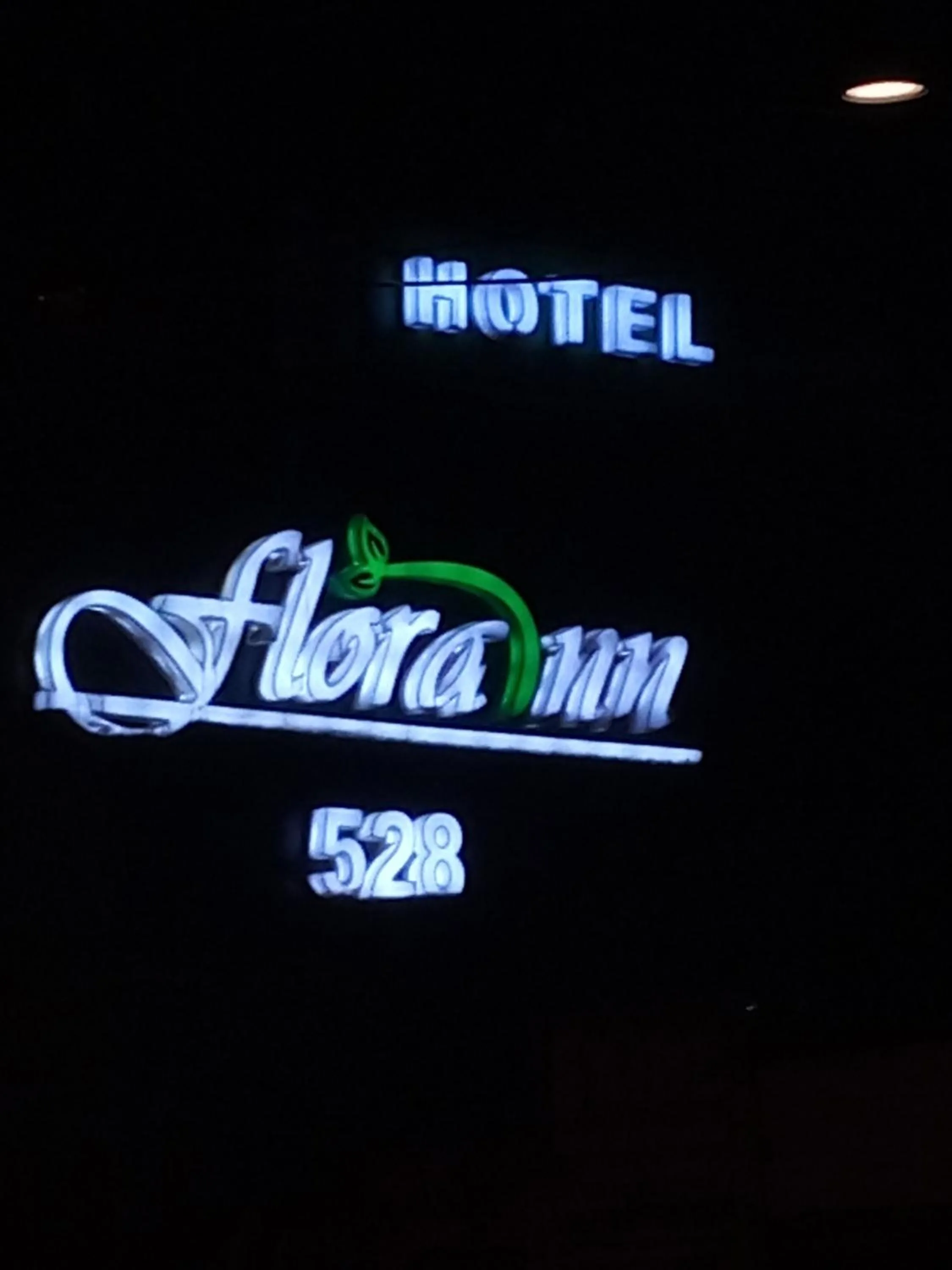 Logo/Certificate/Sign in Hotel Flora Inn
