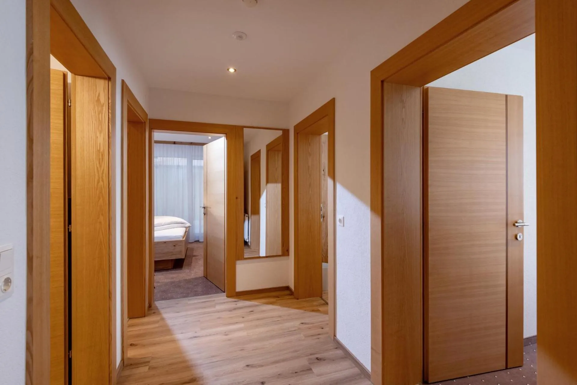 Photo of the whole room, Bed in Alpenhof Hotel Garni Suprême