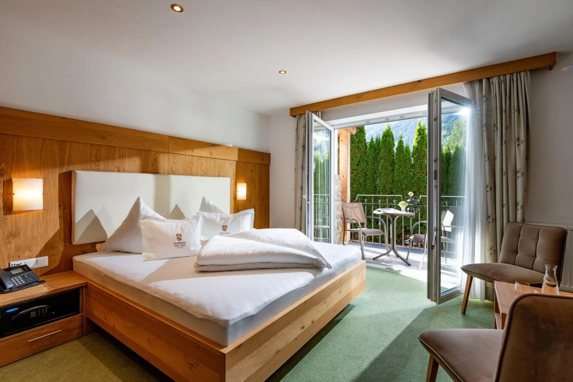 Bed in Alpenhof Hotel Garni Suprême