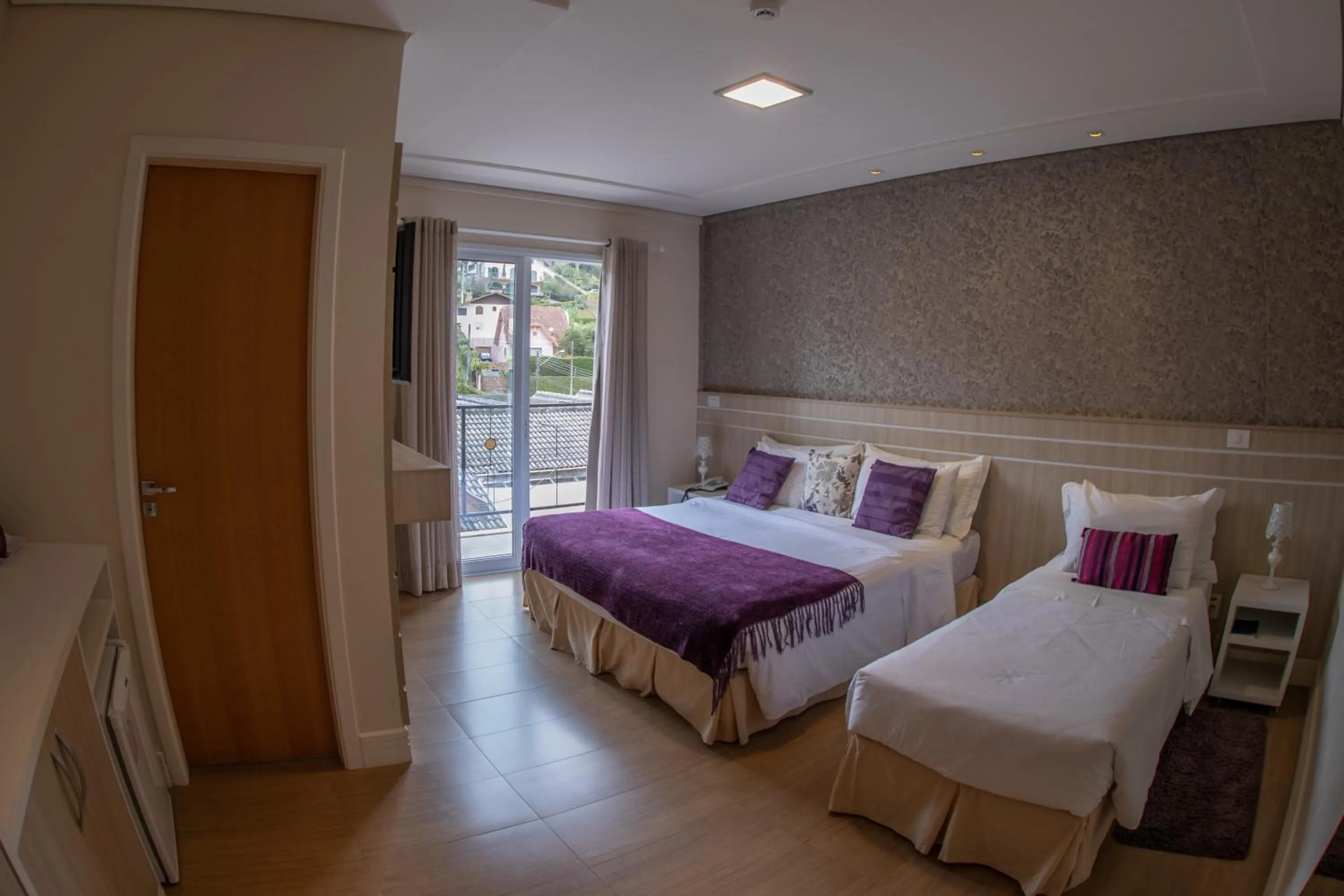 Bed in Pousada Annecy - CAPIVARI Fácil acesso ao centrinho e Baden Bar