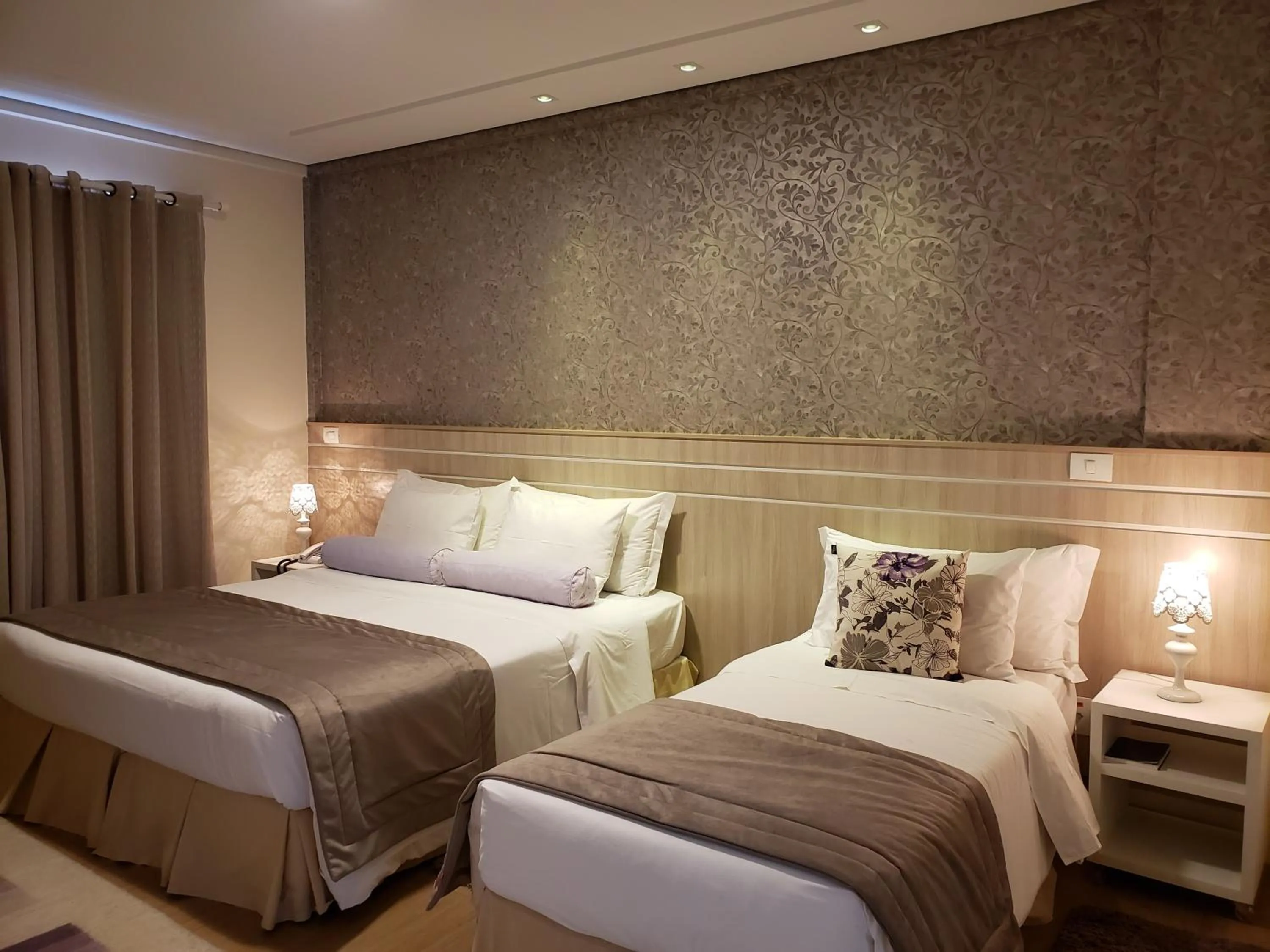 Bed in Pousada Annecy - CAPIVARI Fácil acesso ao centrinho e Baden Bar