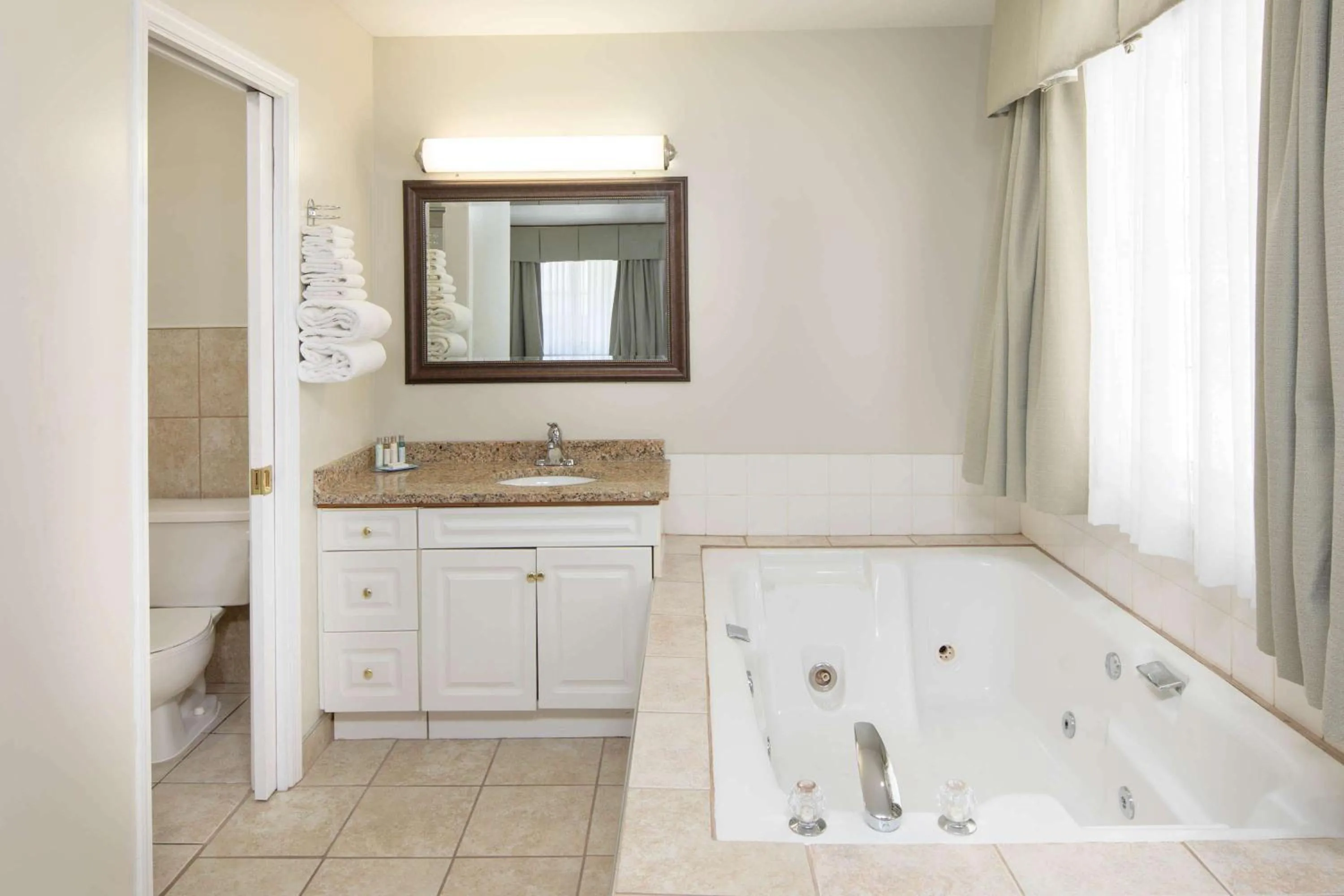 Bathroom in Travelodge by Wyndham Golden Sportsman Lodge