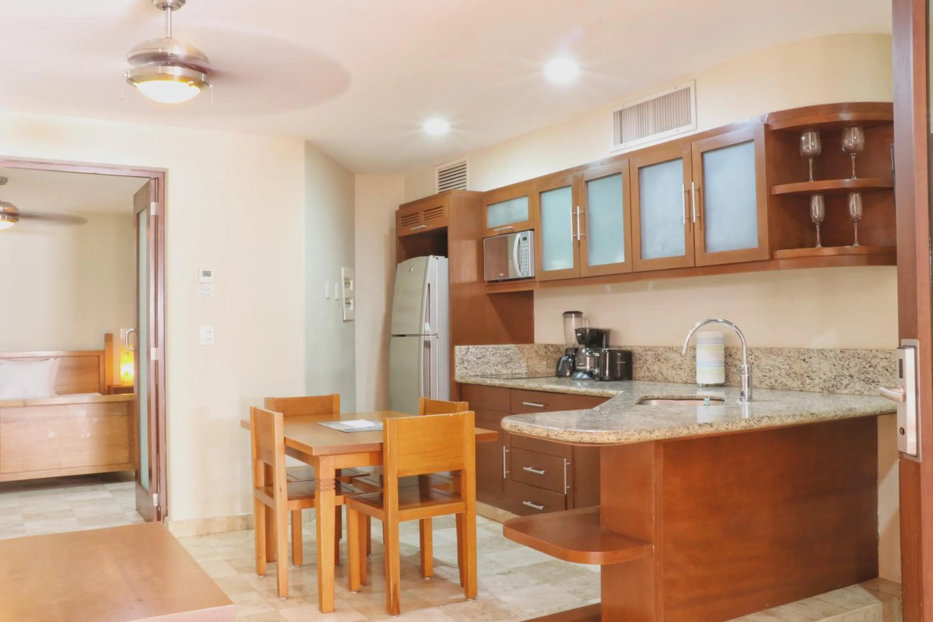 Kitchen or kitchenette in Acanto Hotel Playa del Carmen, Trademark Collection by Wyndham