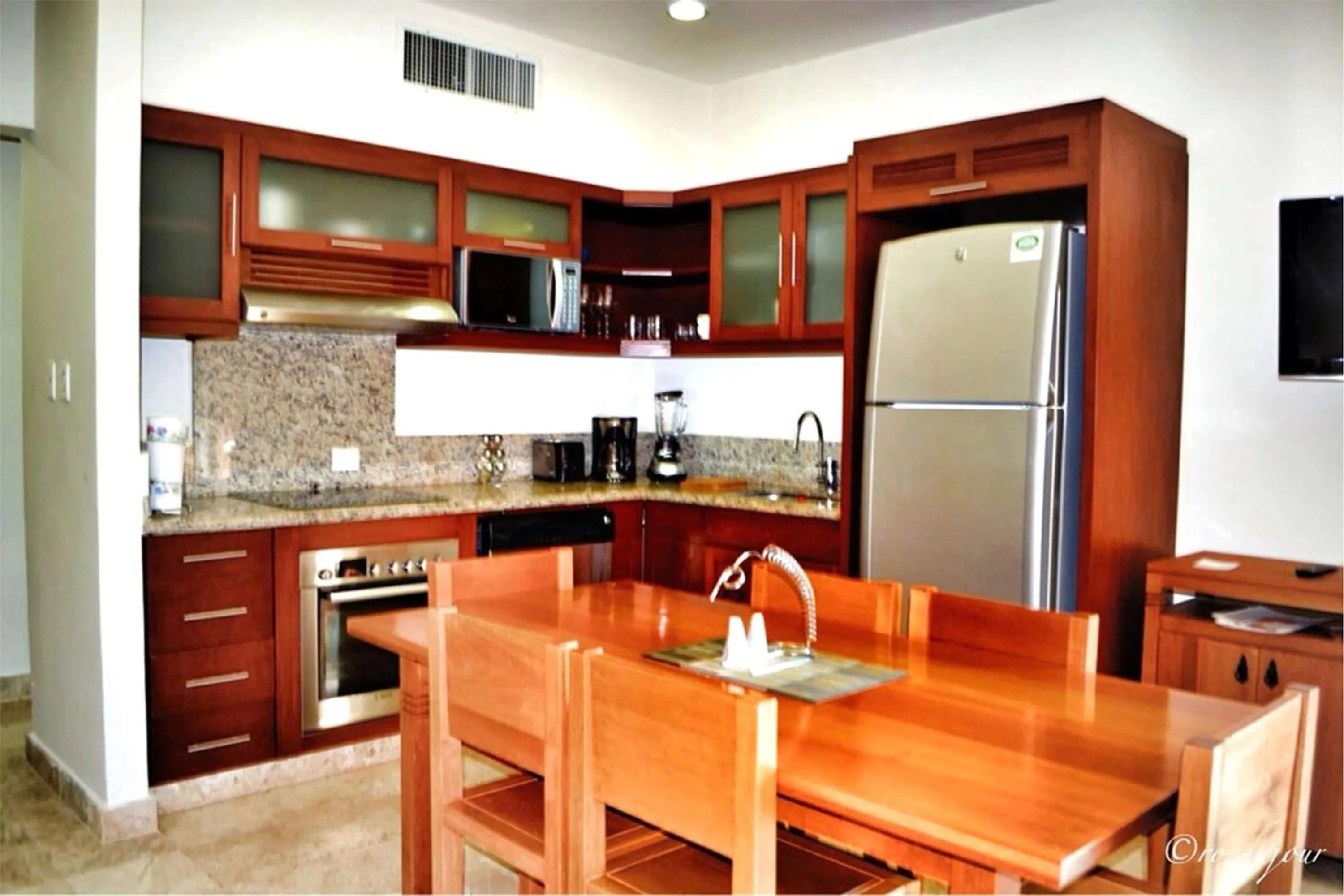 Kitchen or kitchenette in Acanto Hotel Playa del Carmen, Trademark Collection by Wyndham