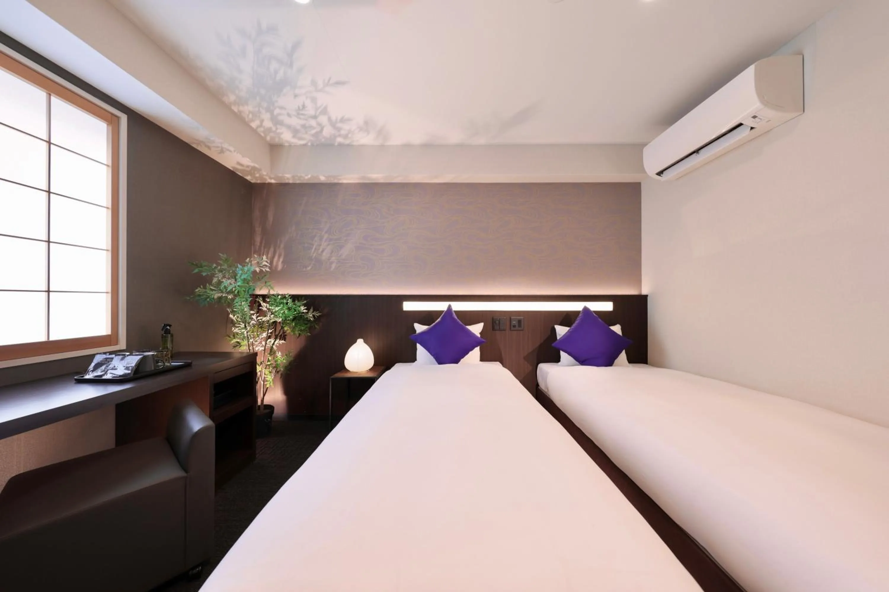 Bed in Marutamachi Crystal Hotel