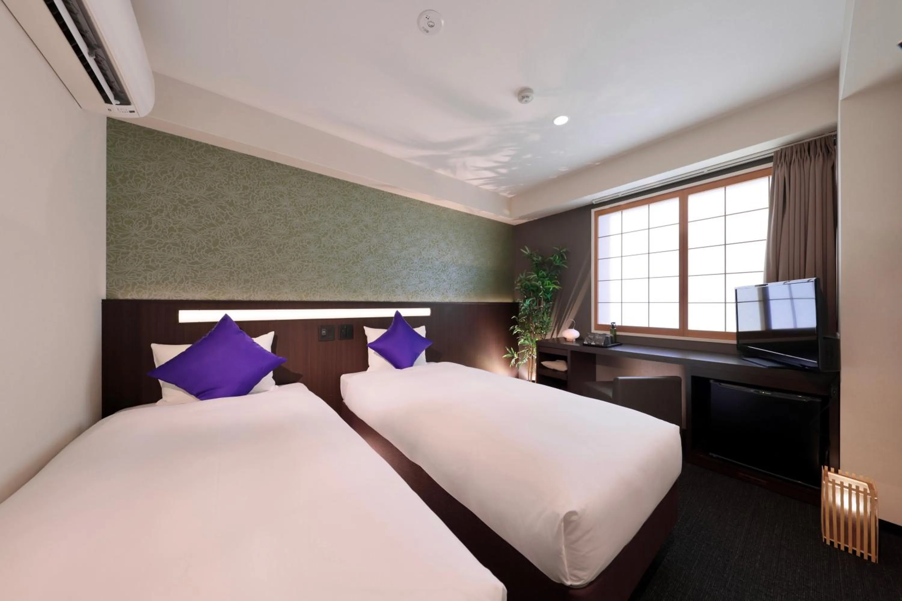 Bed in Marutamachi Crystal Hotel