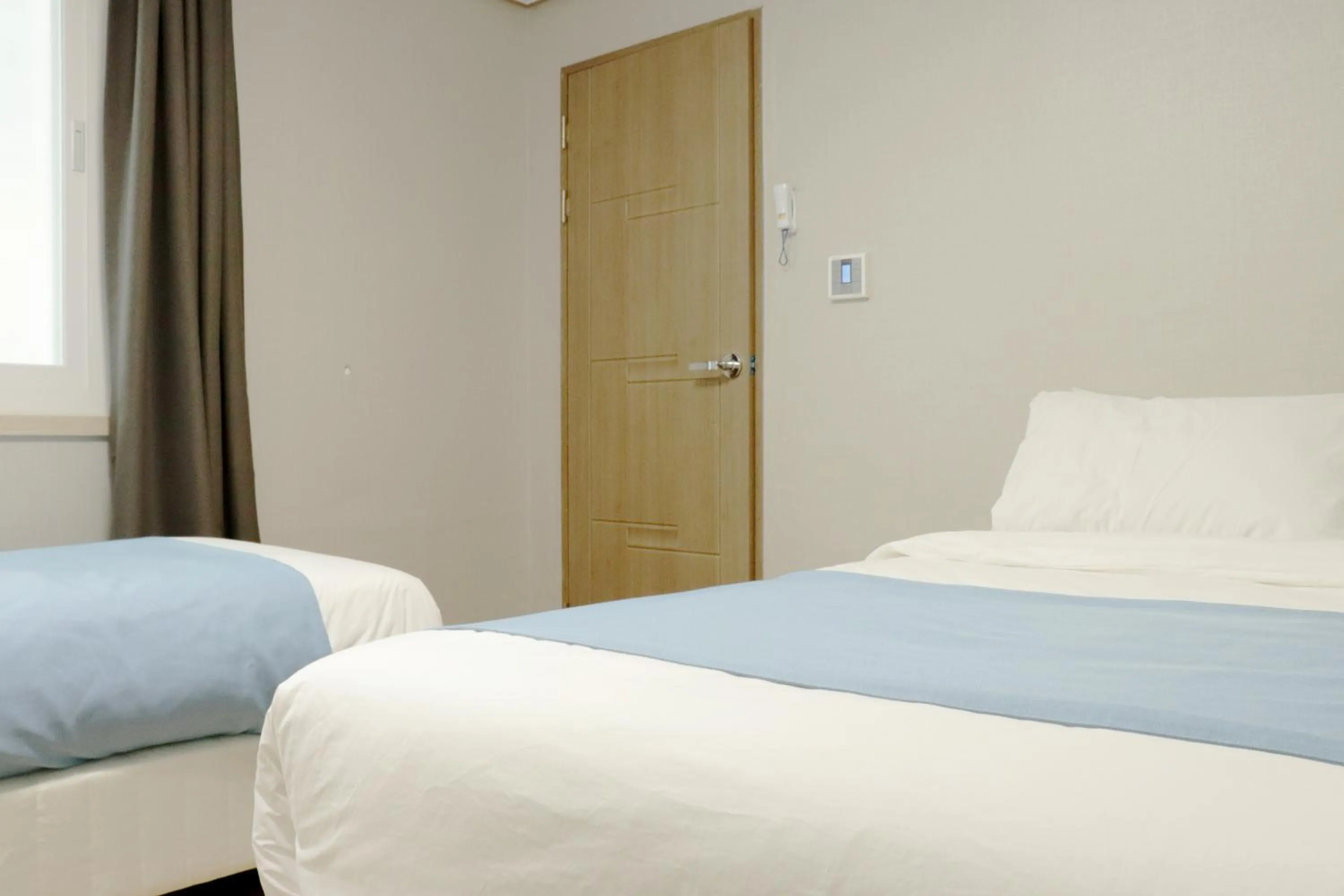 Bed in Ora Stay Hotel