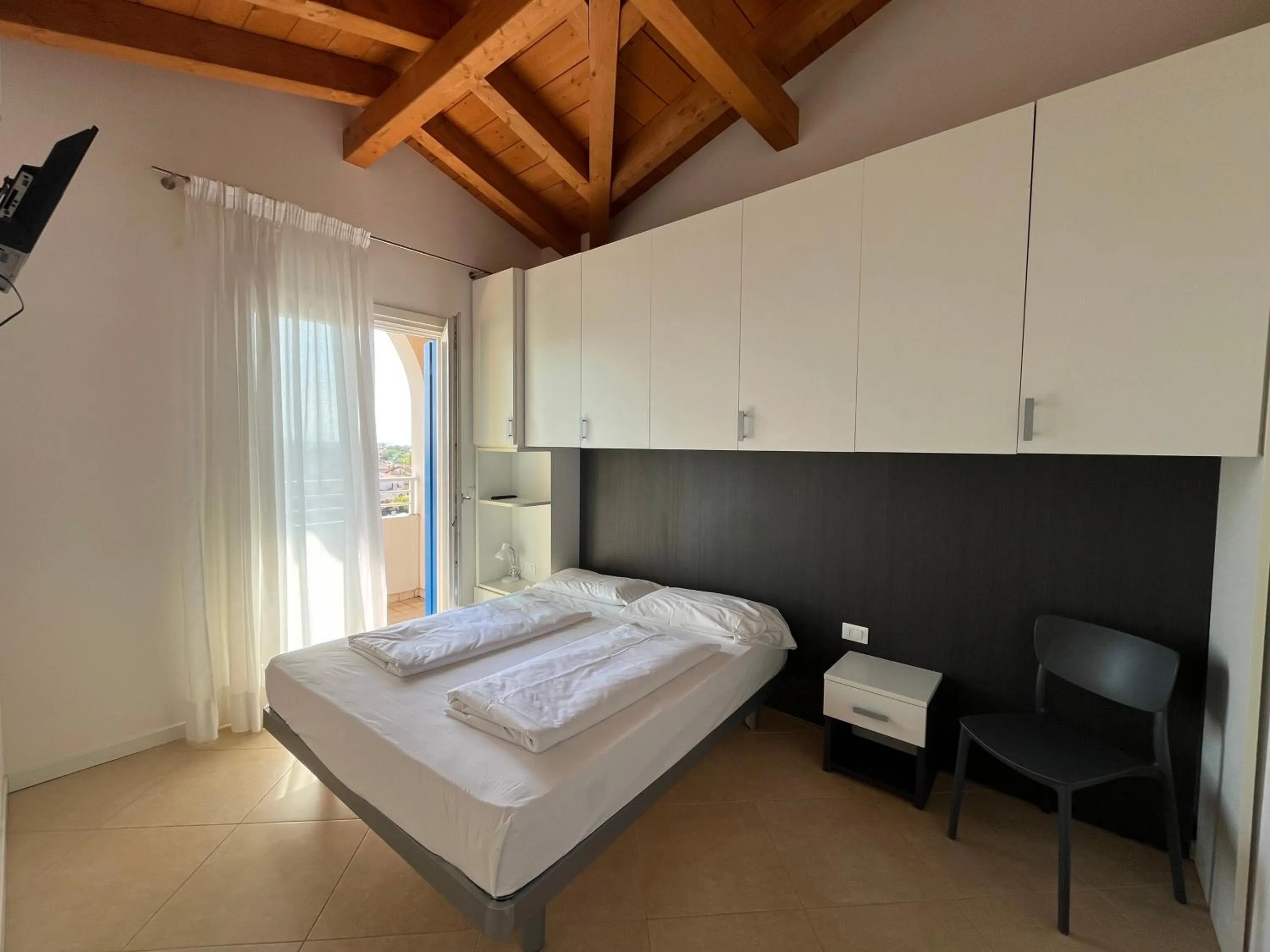 Bed in Villaggio Hemingway - Family Aparthotel